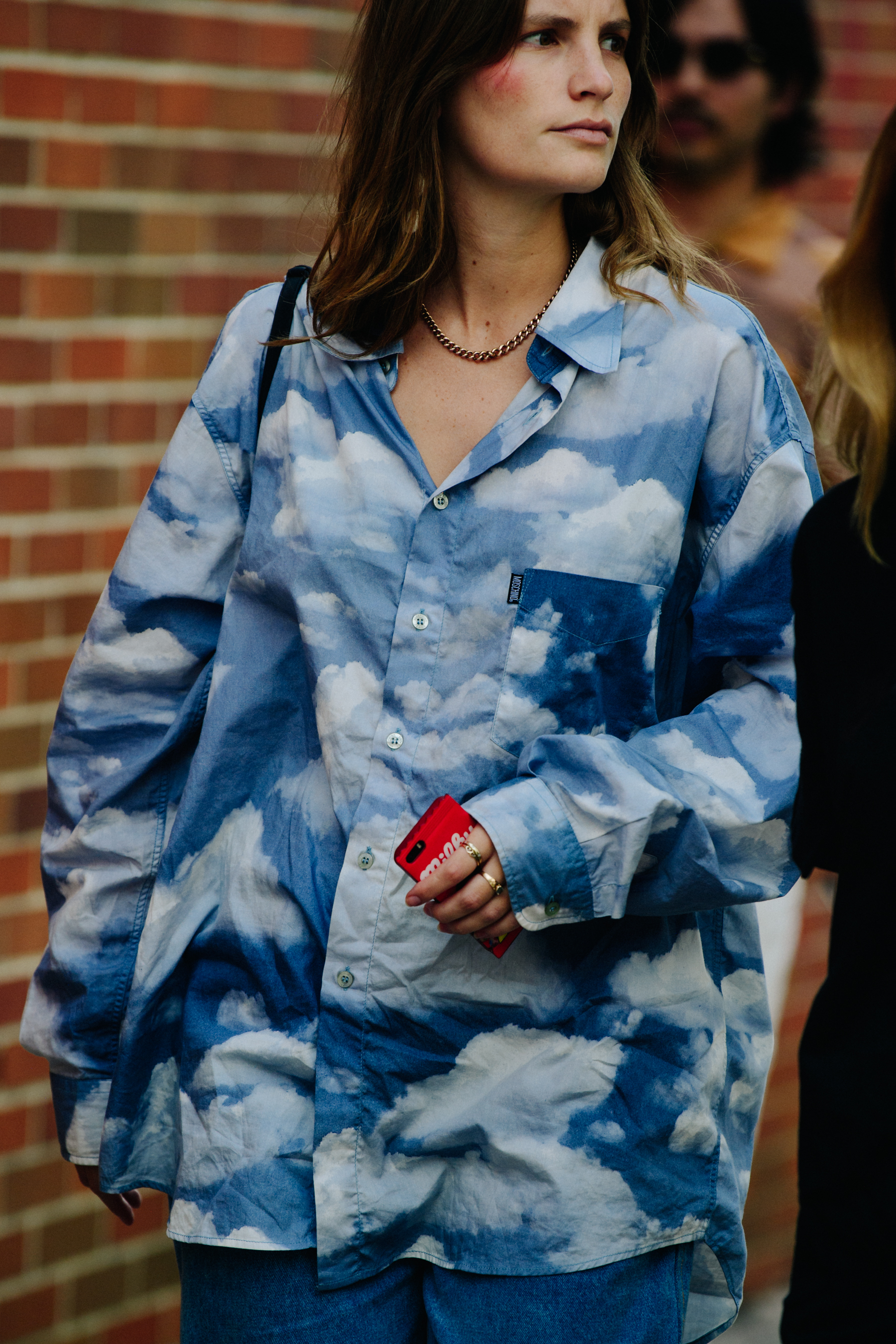 Woman wearing blue cloud top