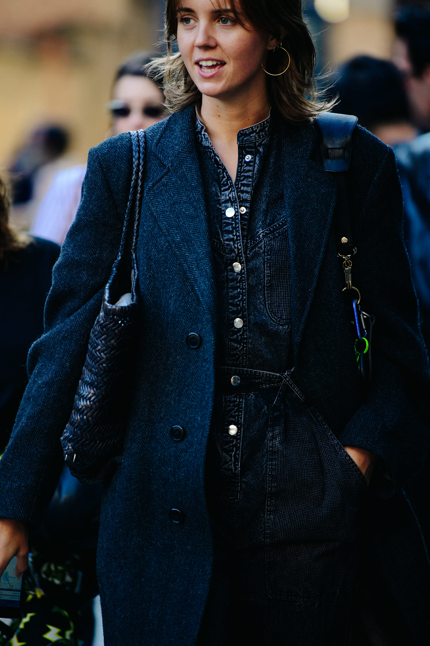 Woman wearing dark denim jumpsuit