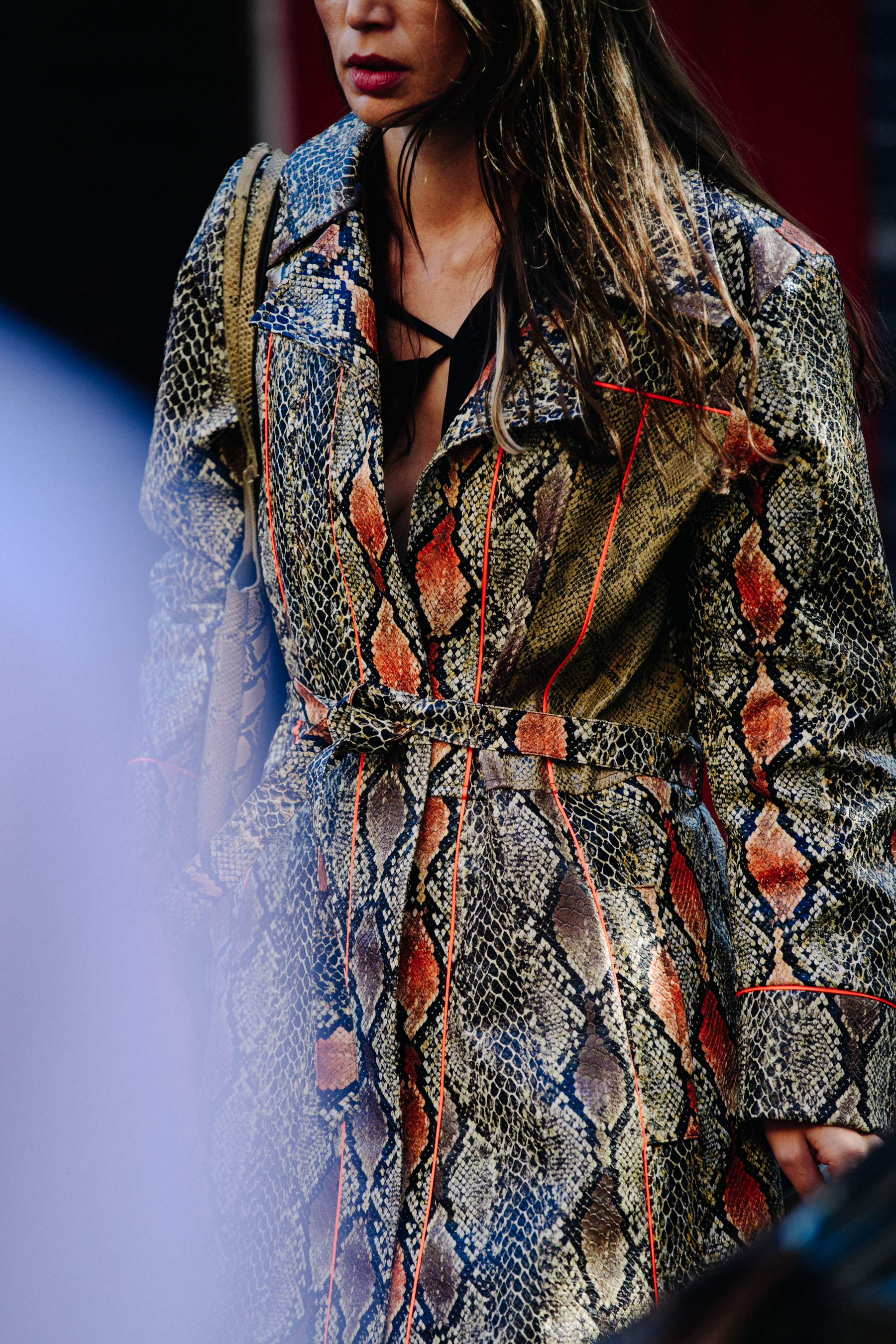 Woman wearing snakeskin coat