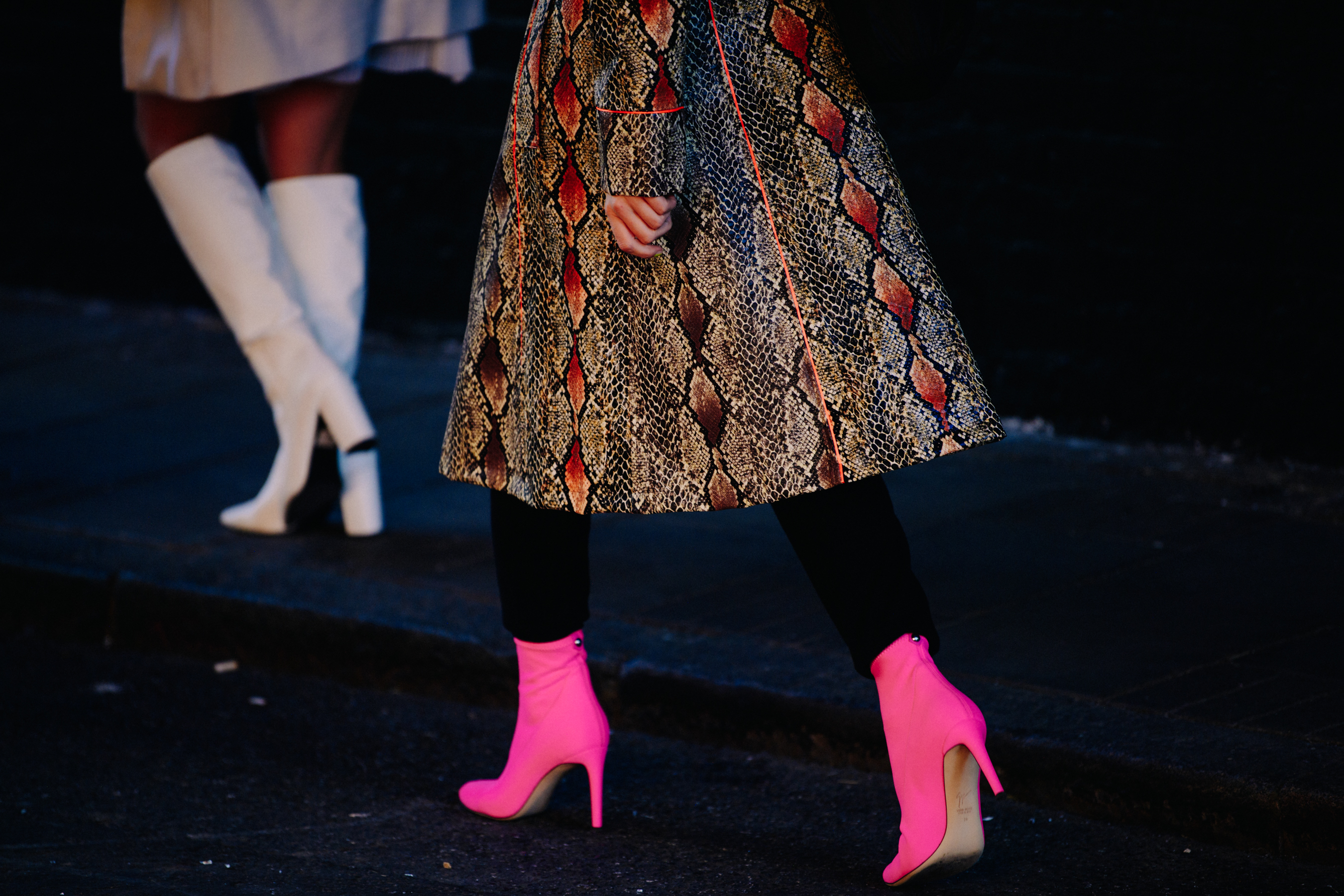 Woman wearing snakeskin coat