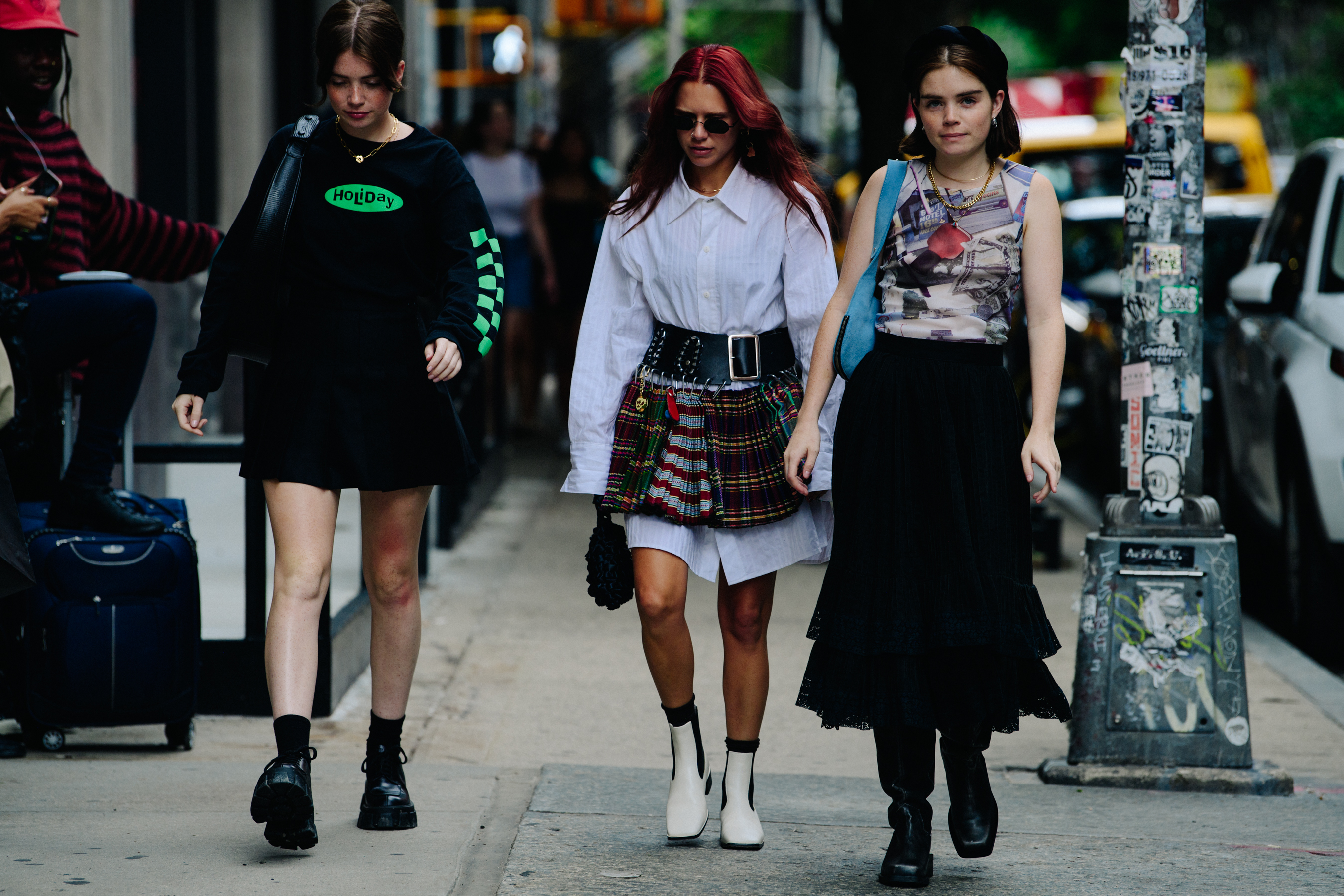 Three women wearing stylish outfits