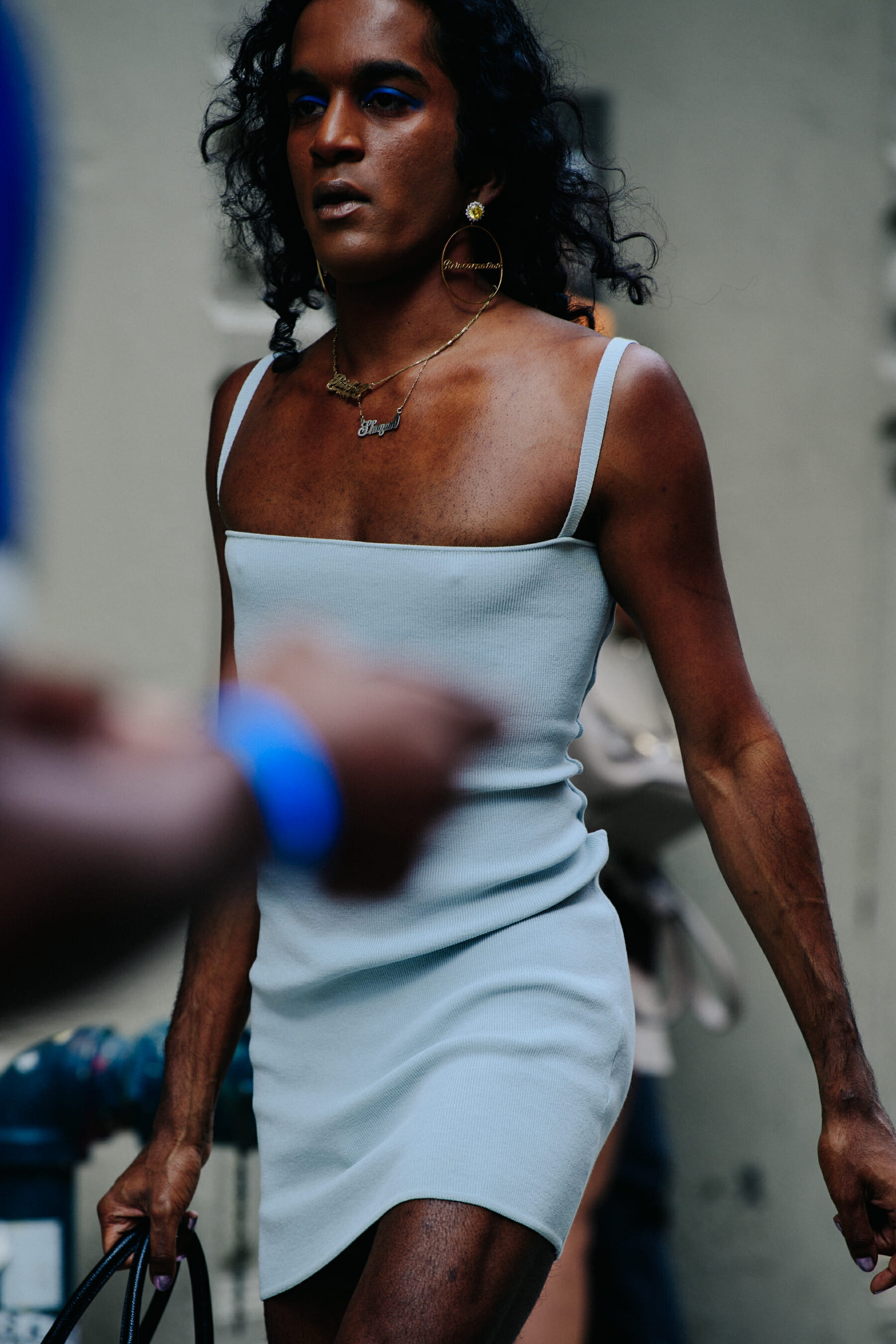 Man wearing blue dress