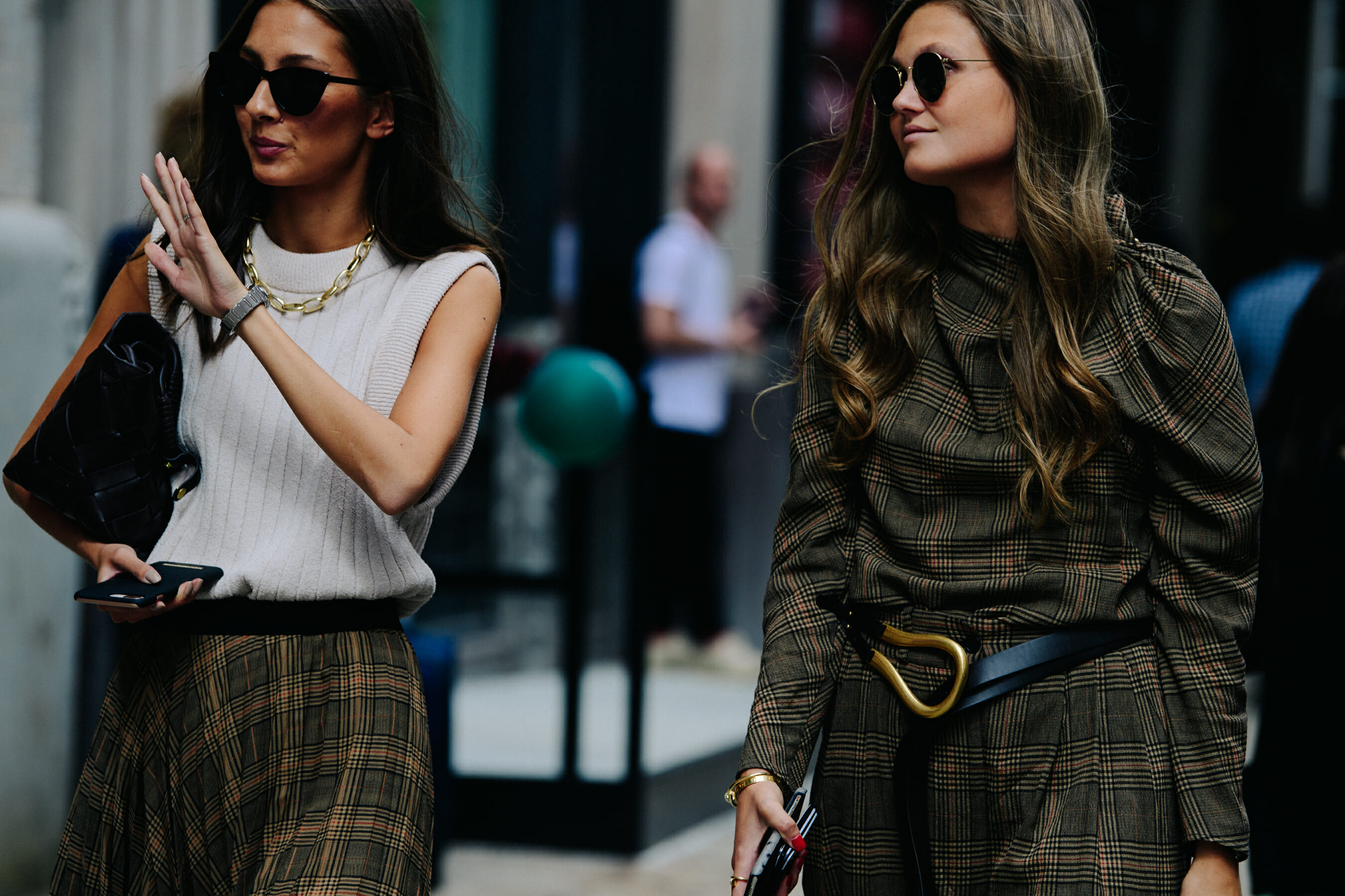 Two women wearing check