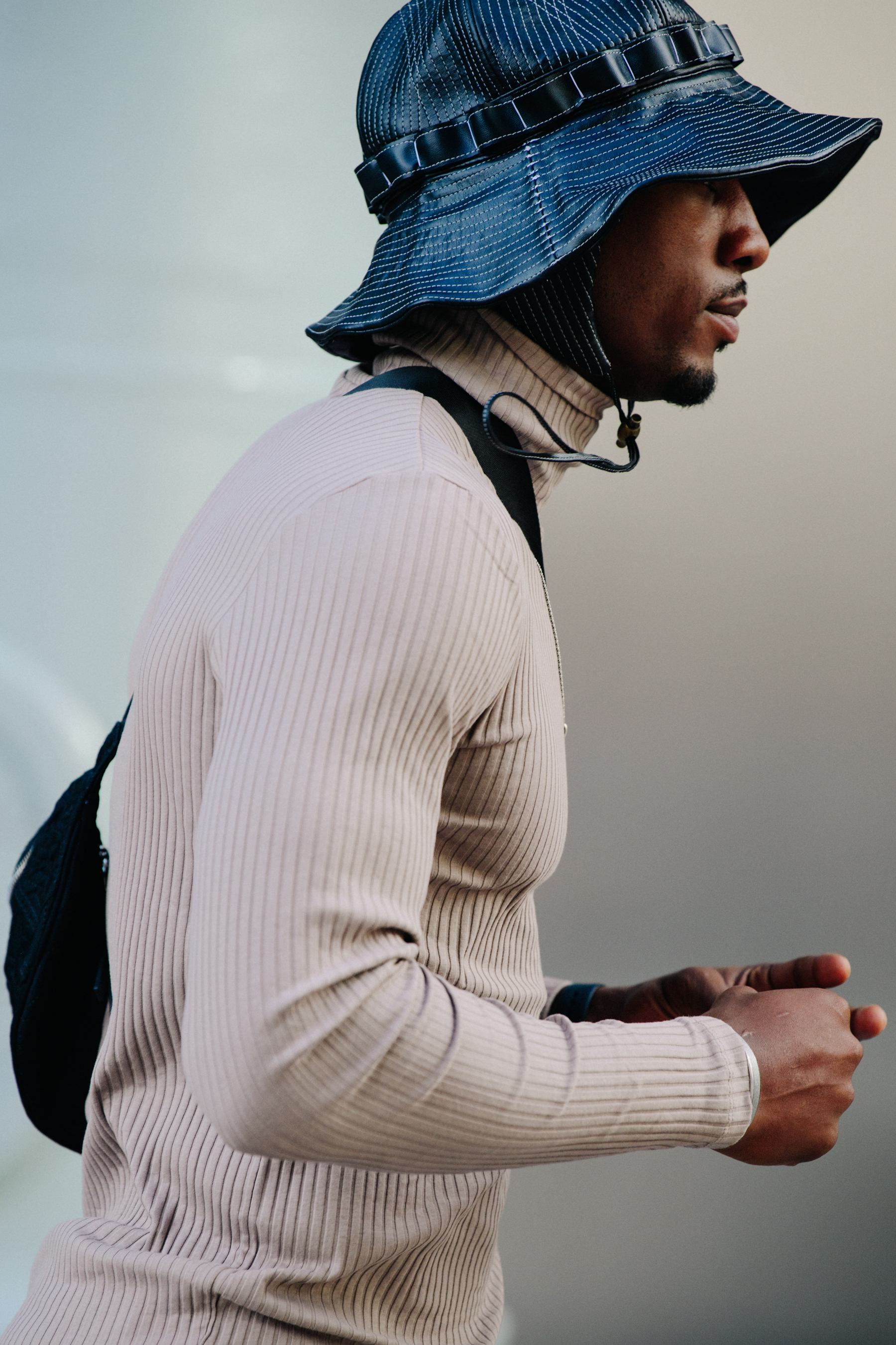 Man wearing black bucket hat
