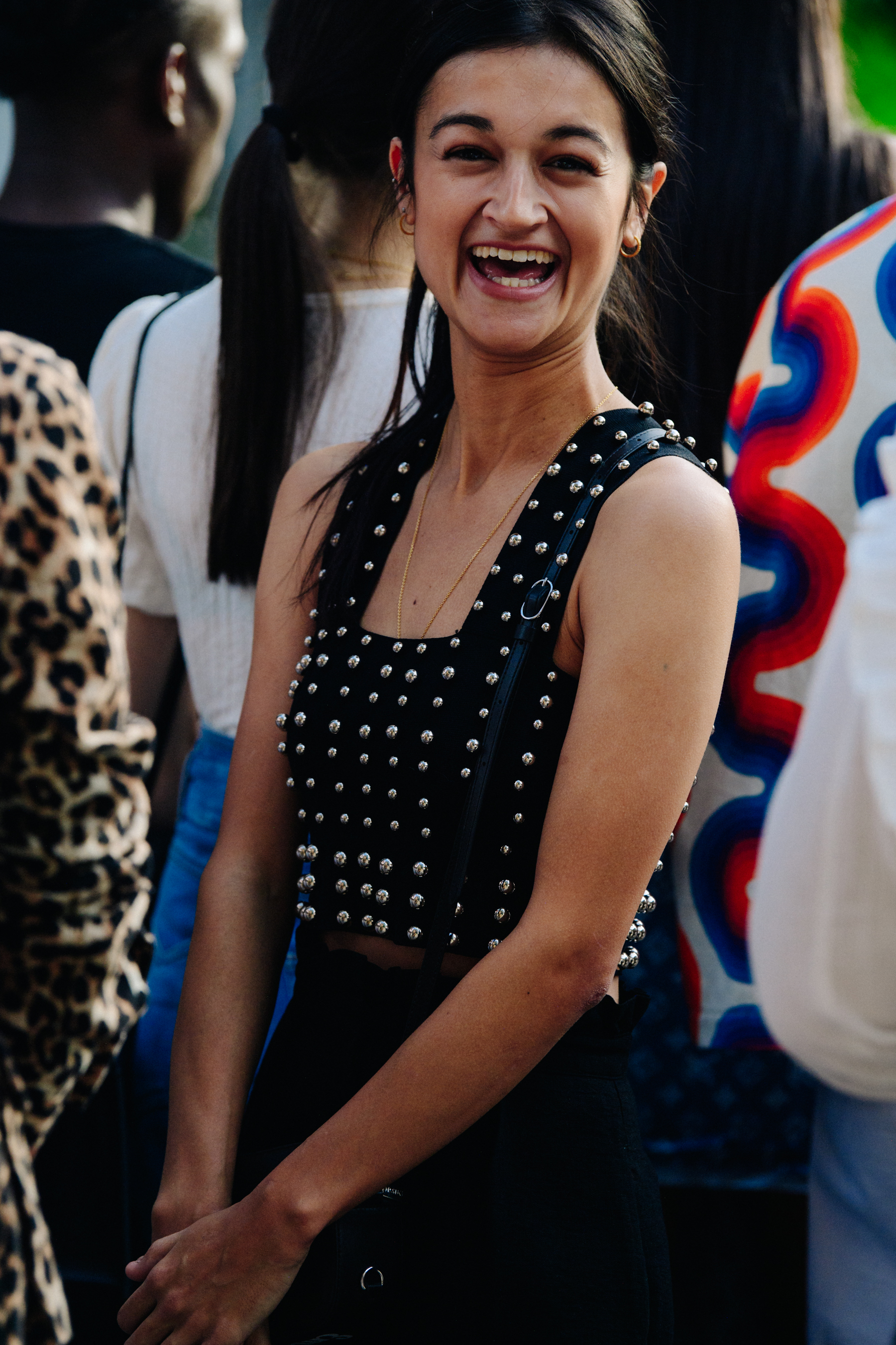 Woman wearing vest with metal studs