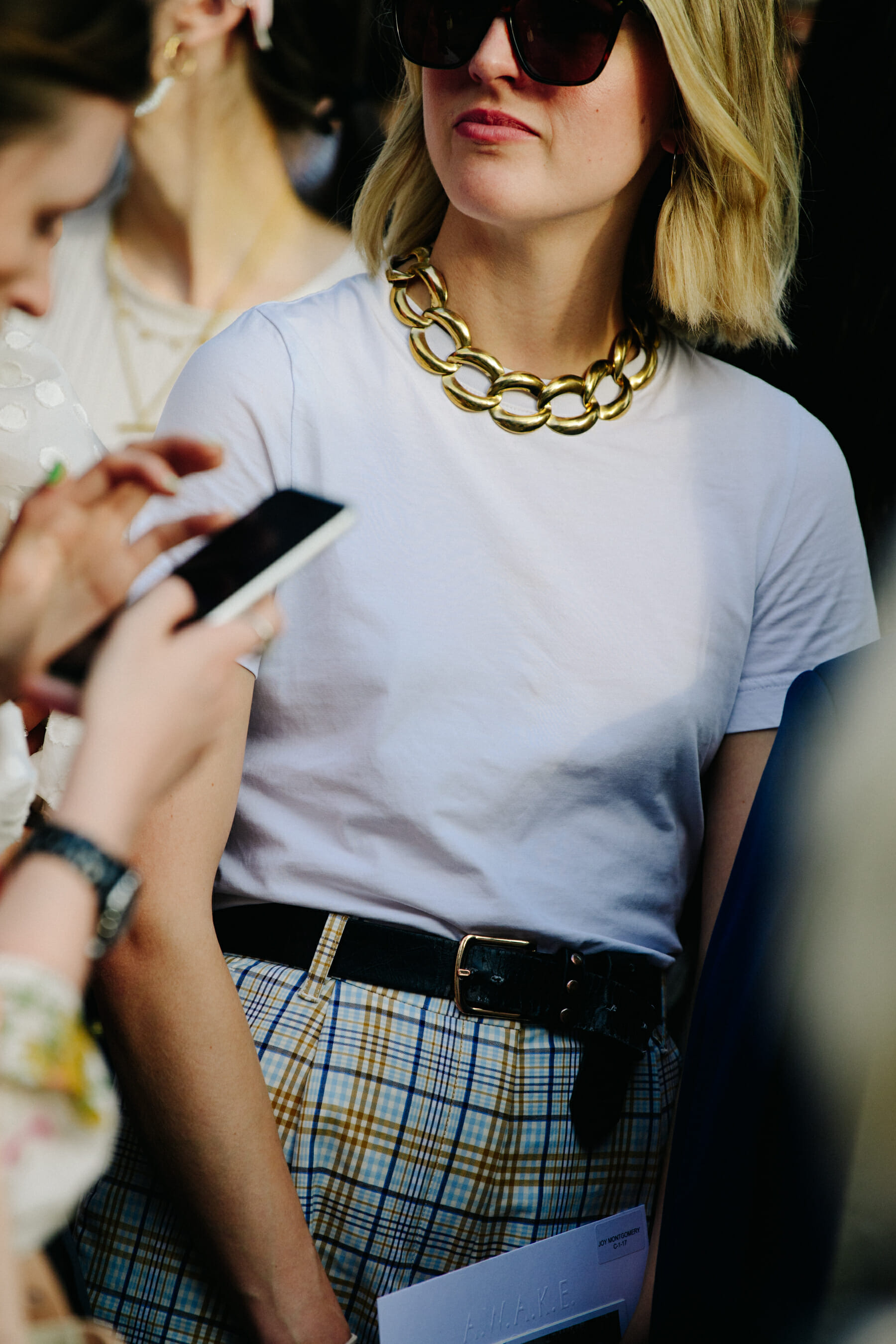 Woman wearing gold necklace