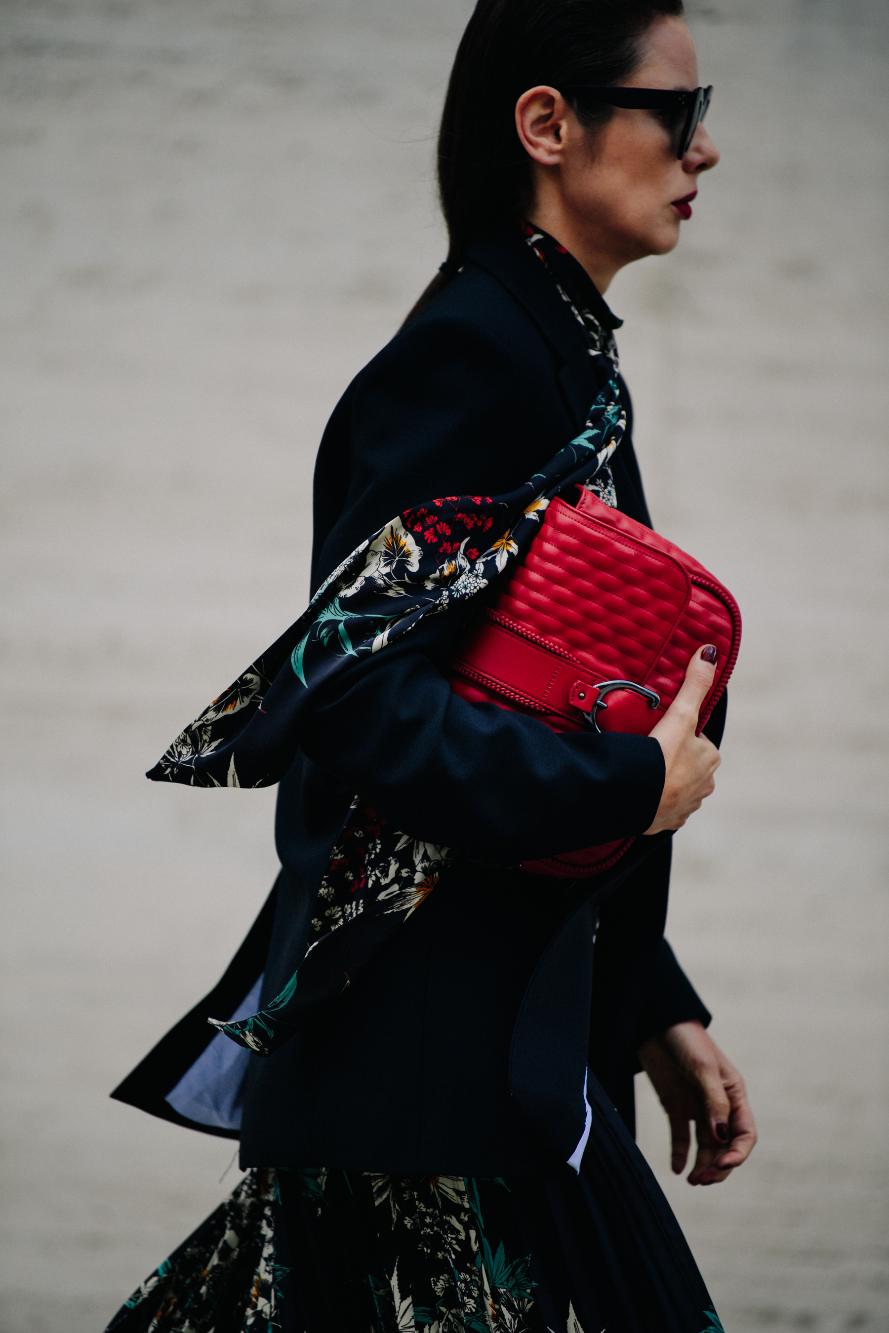 Woman carrying red bag