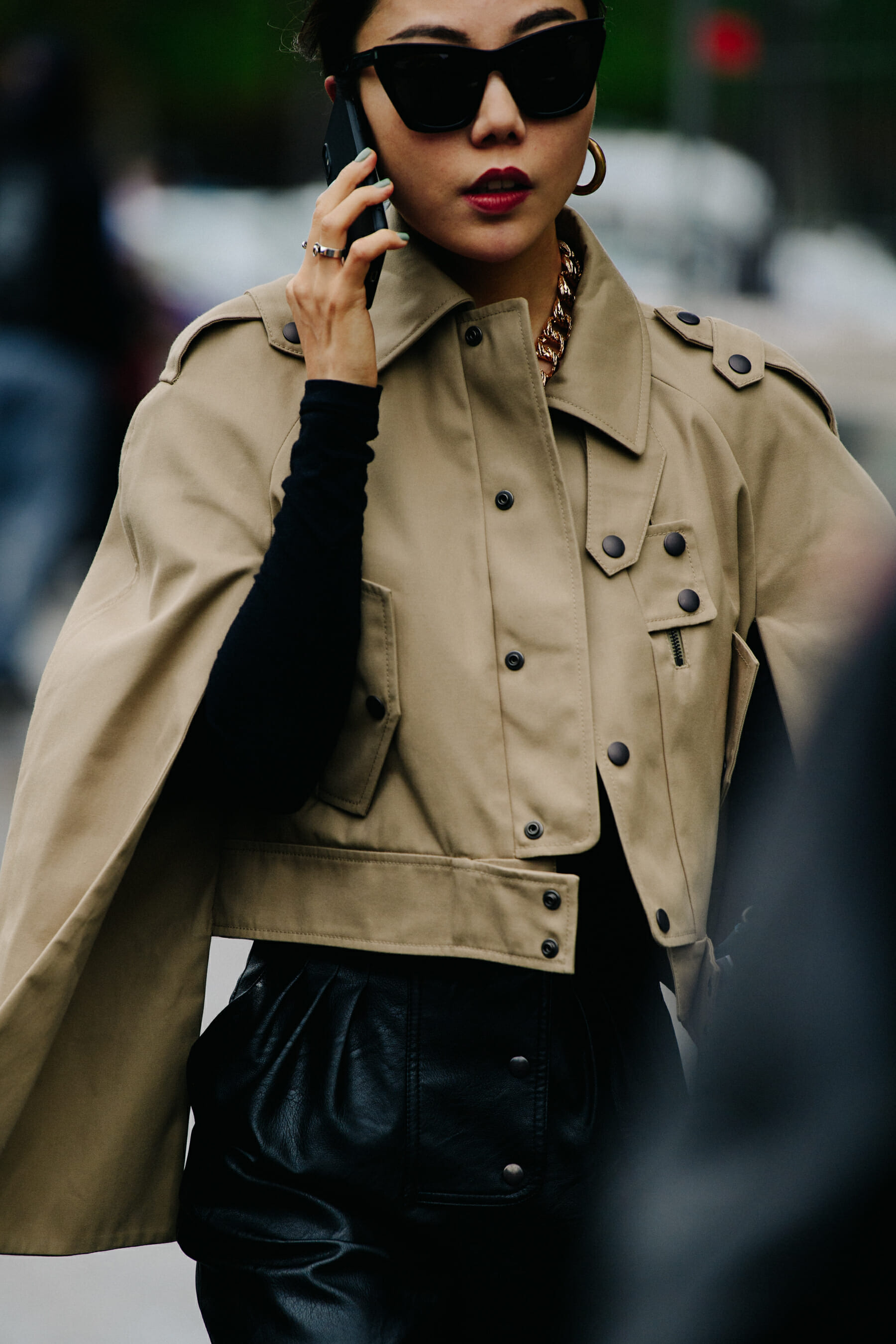 Woman wearing tan jacket