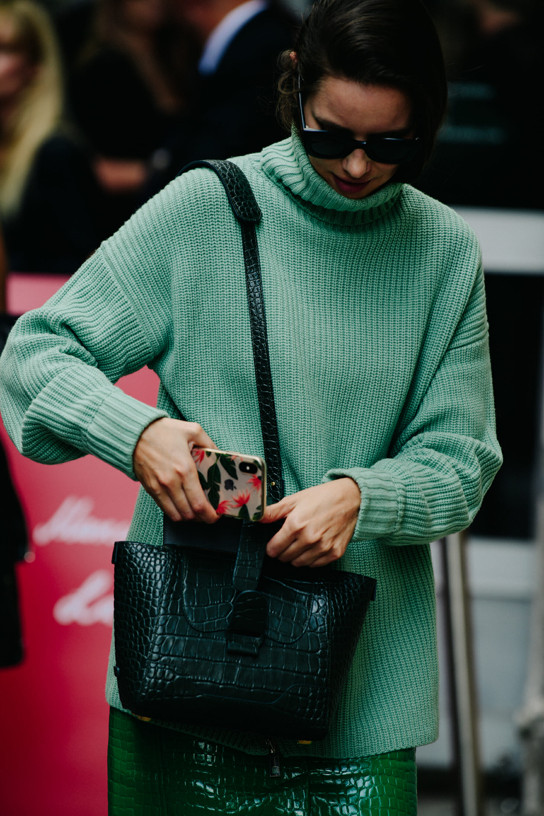 Woman wearing green jumper