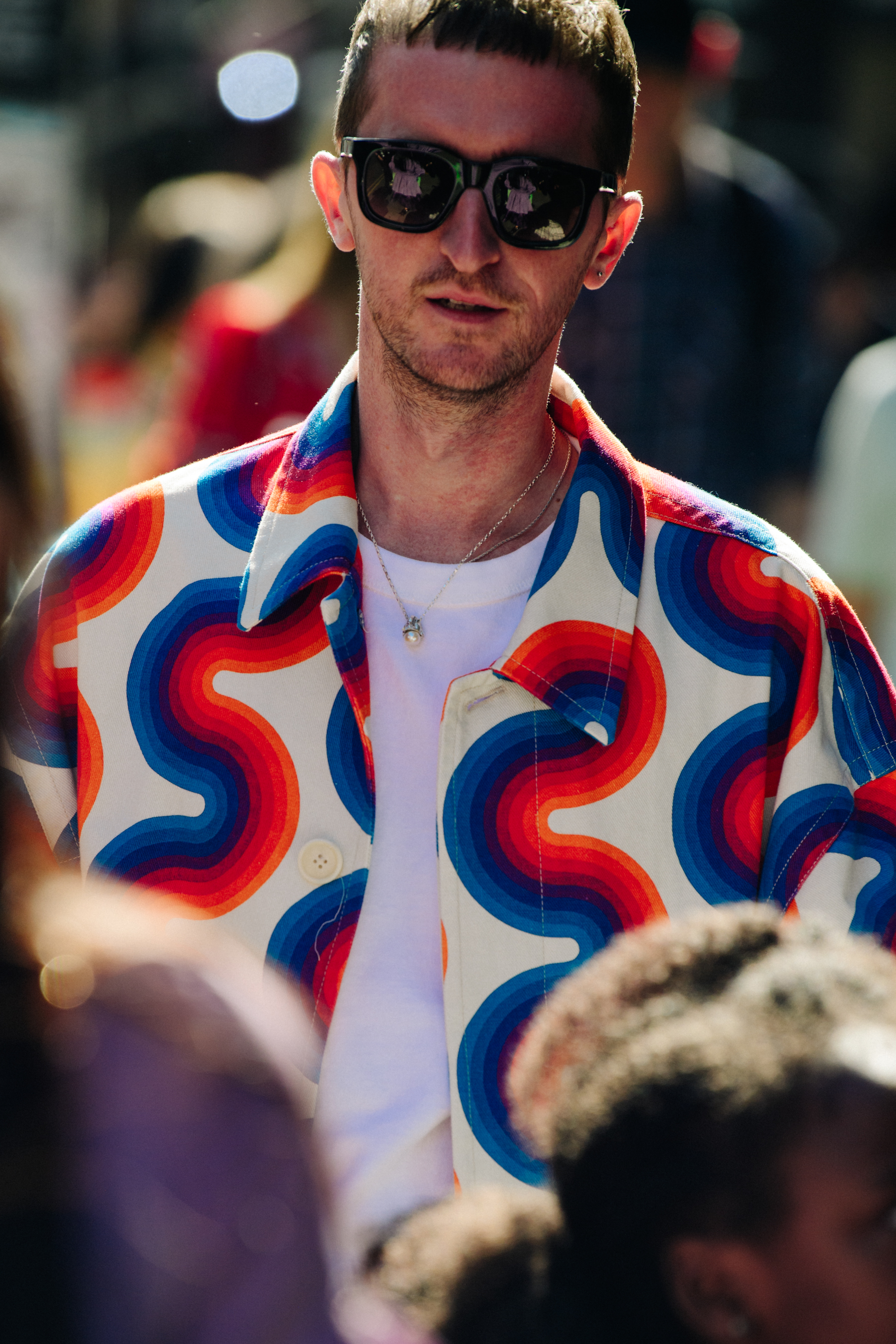 Man wearing colourful pattern jacket