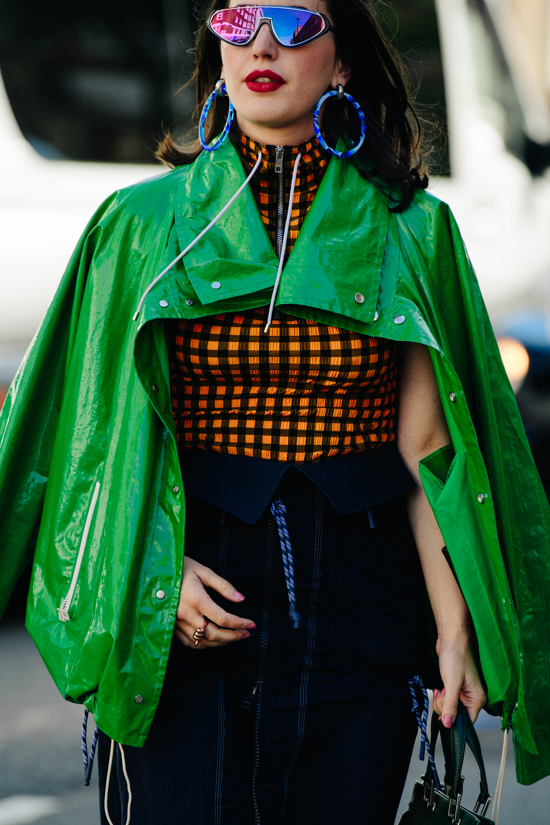 Woman wearing green raincoat