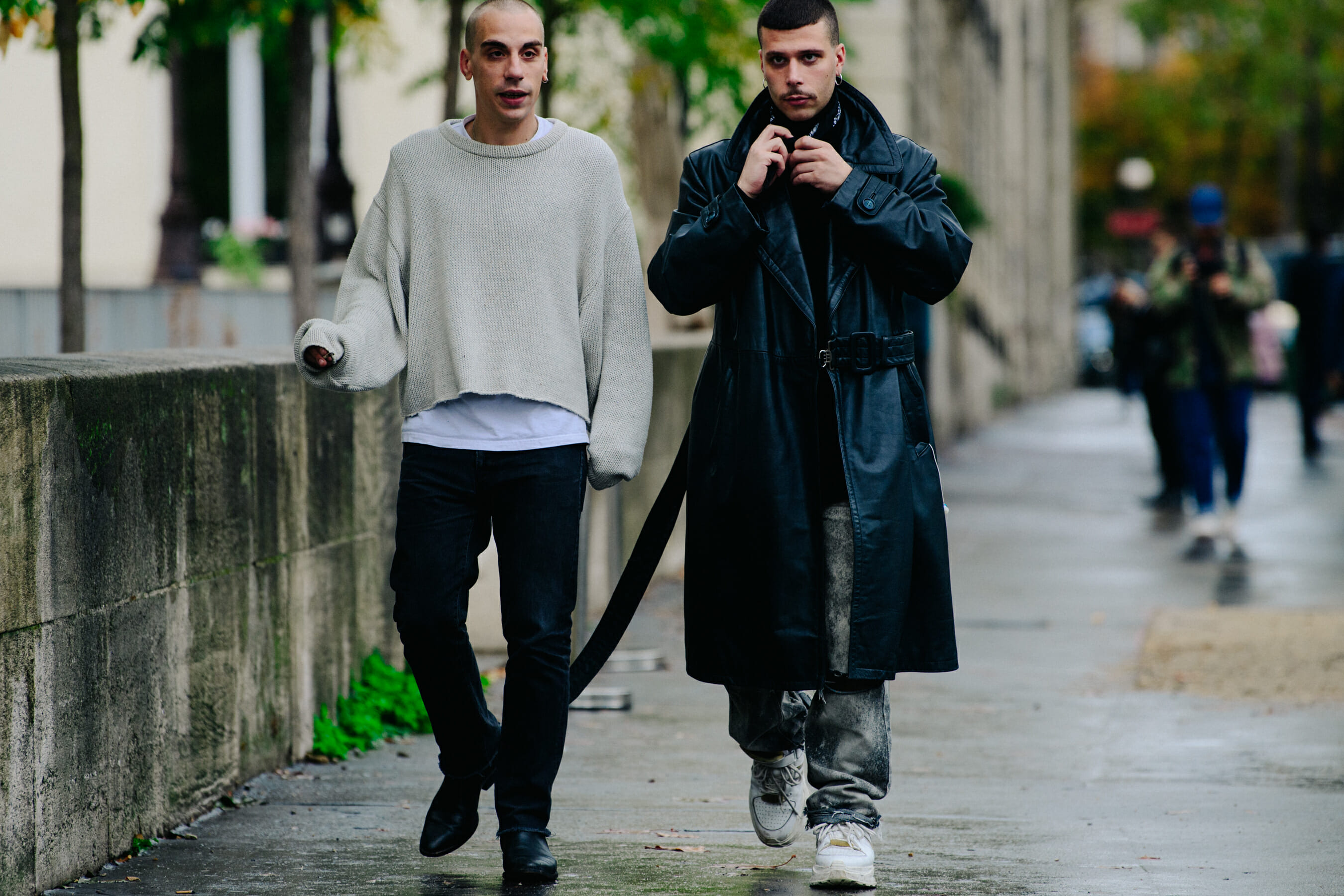 Two men wearing light and dark clothing