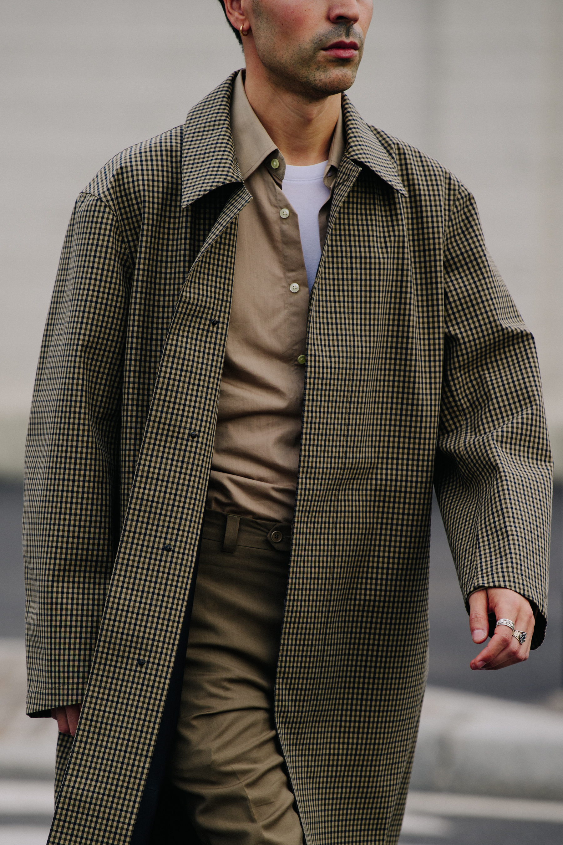 Man wearing long check coat
