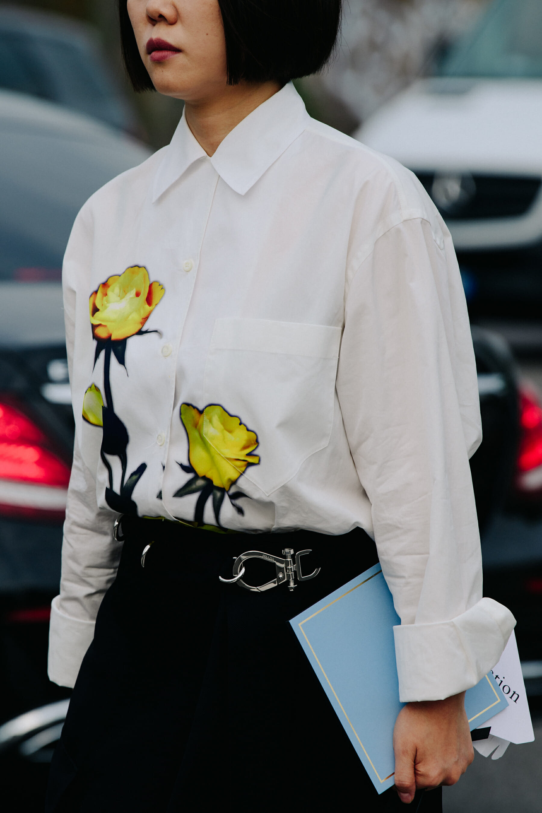 Woman wearing white floral shirt