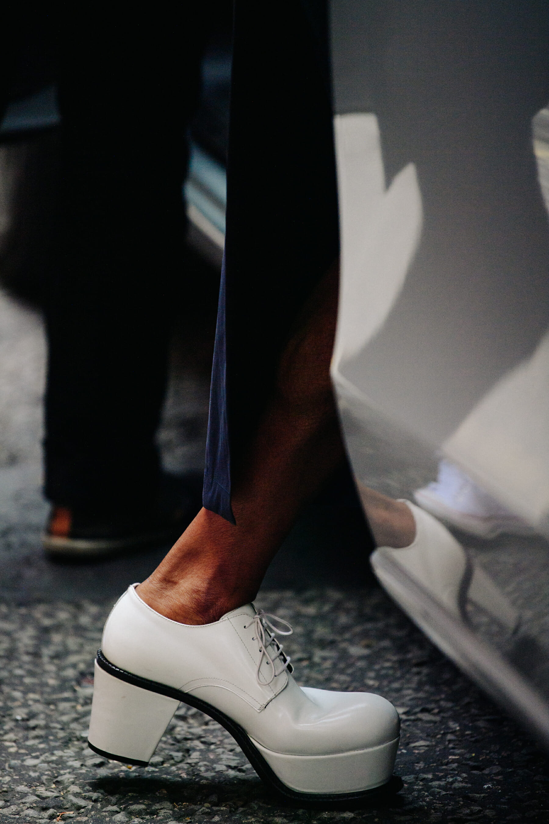 Woman wearing white heels