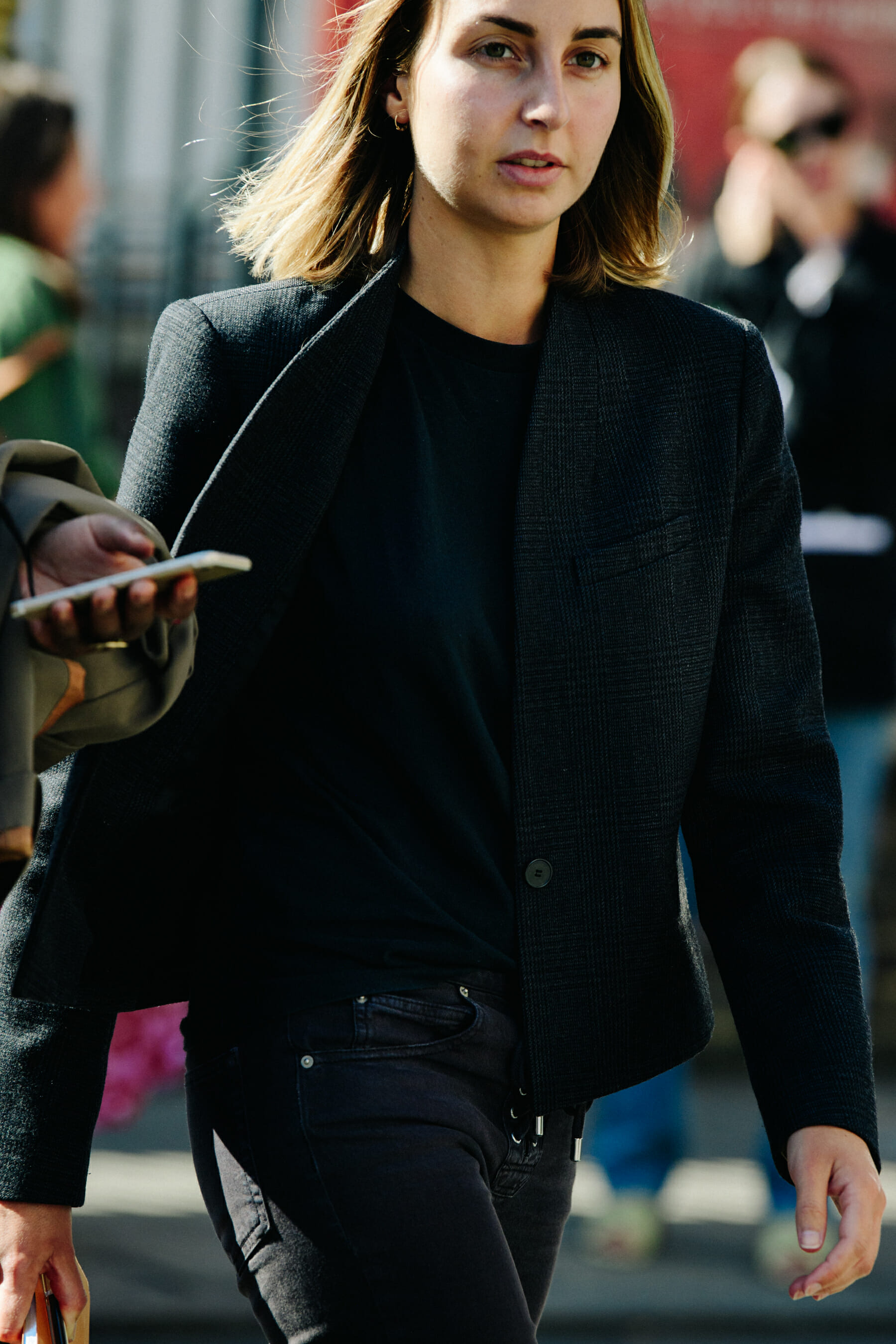 Woman wearing dark suit jacket