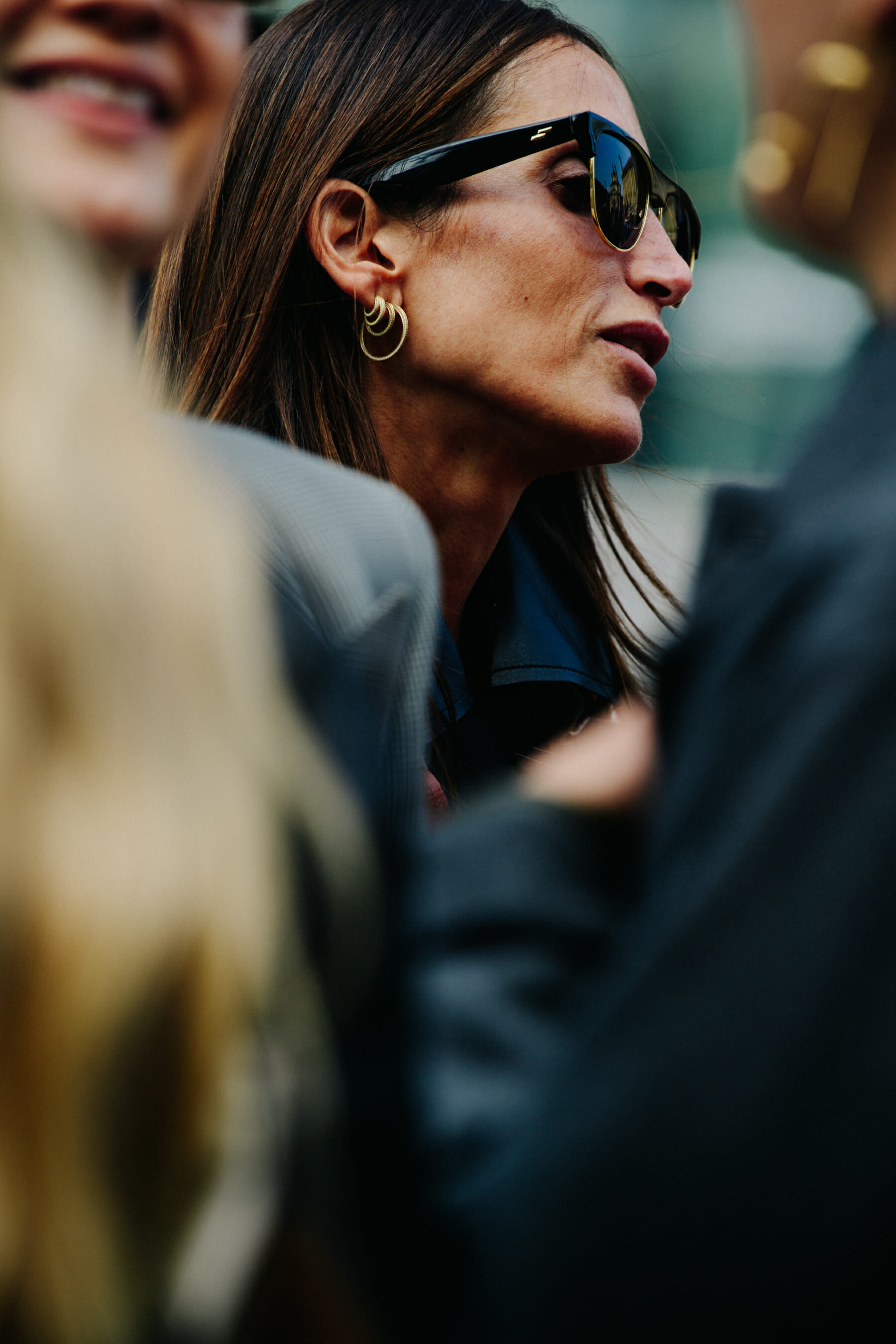 Woman wearing gold earrings