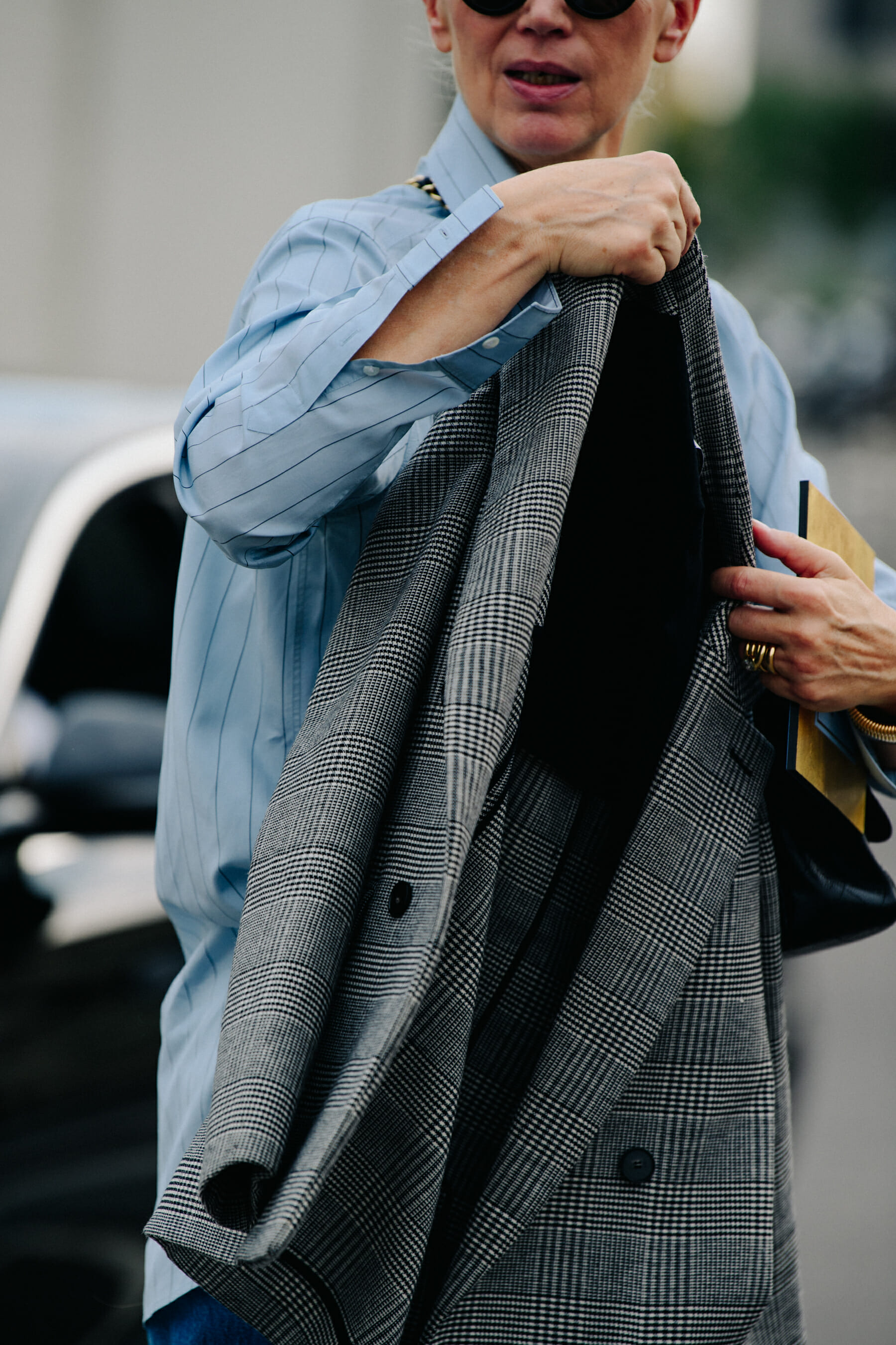 Woman carrying suit jacket