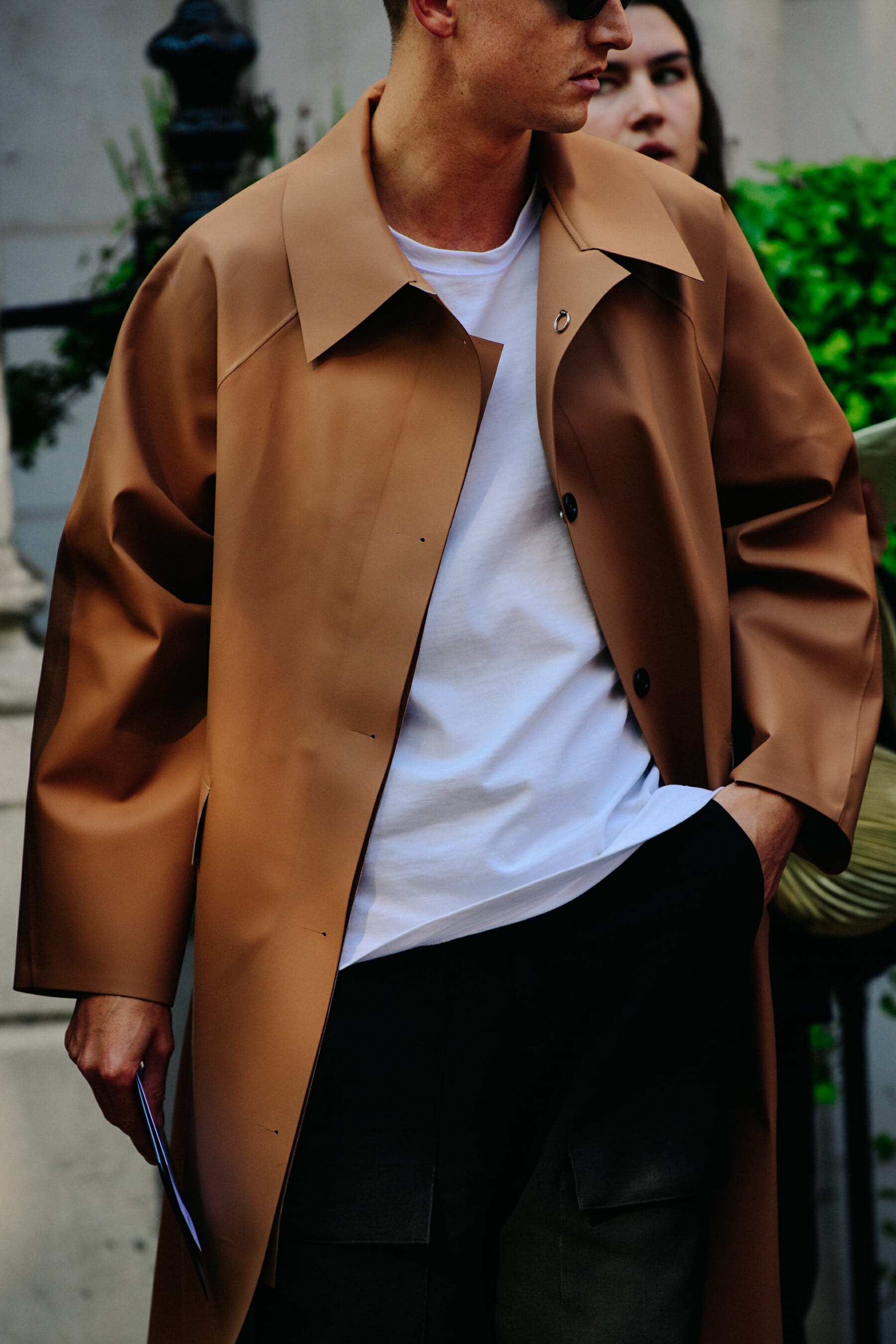 Man wearing leather trench coat