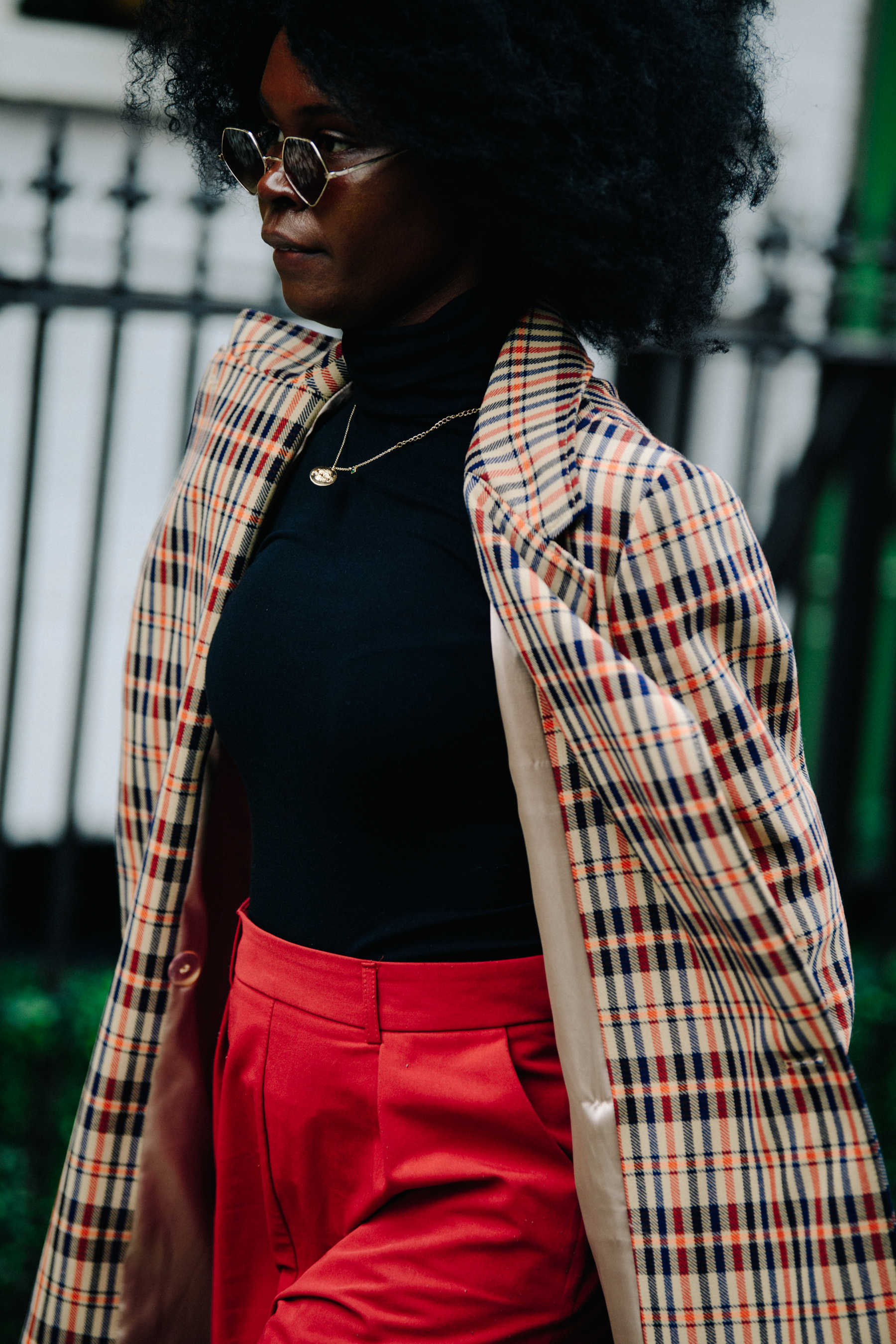 Woman wearing check coat
