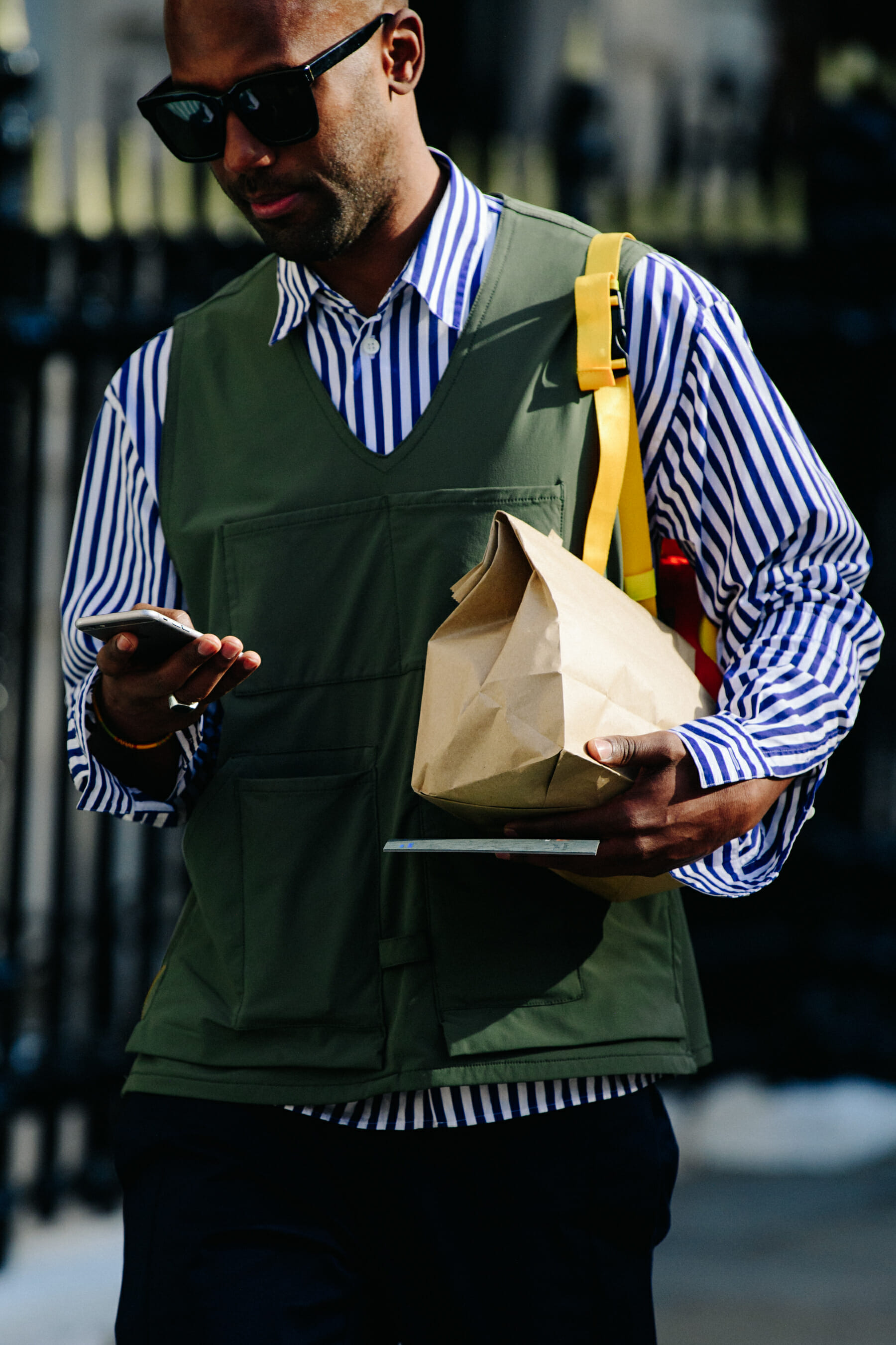 Man wearing green vest