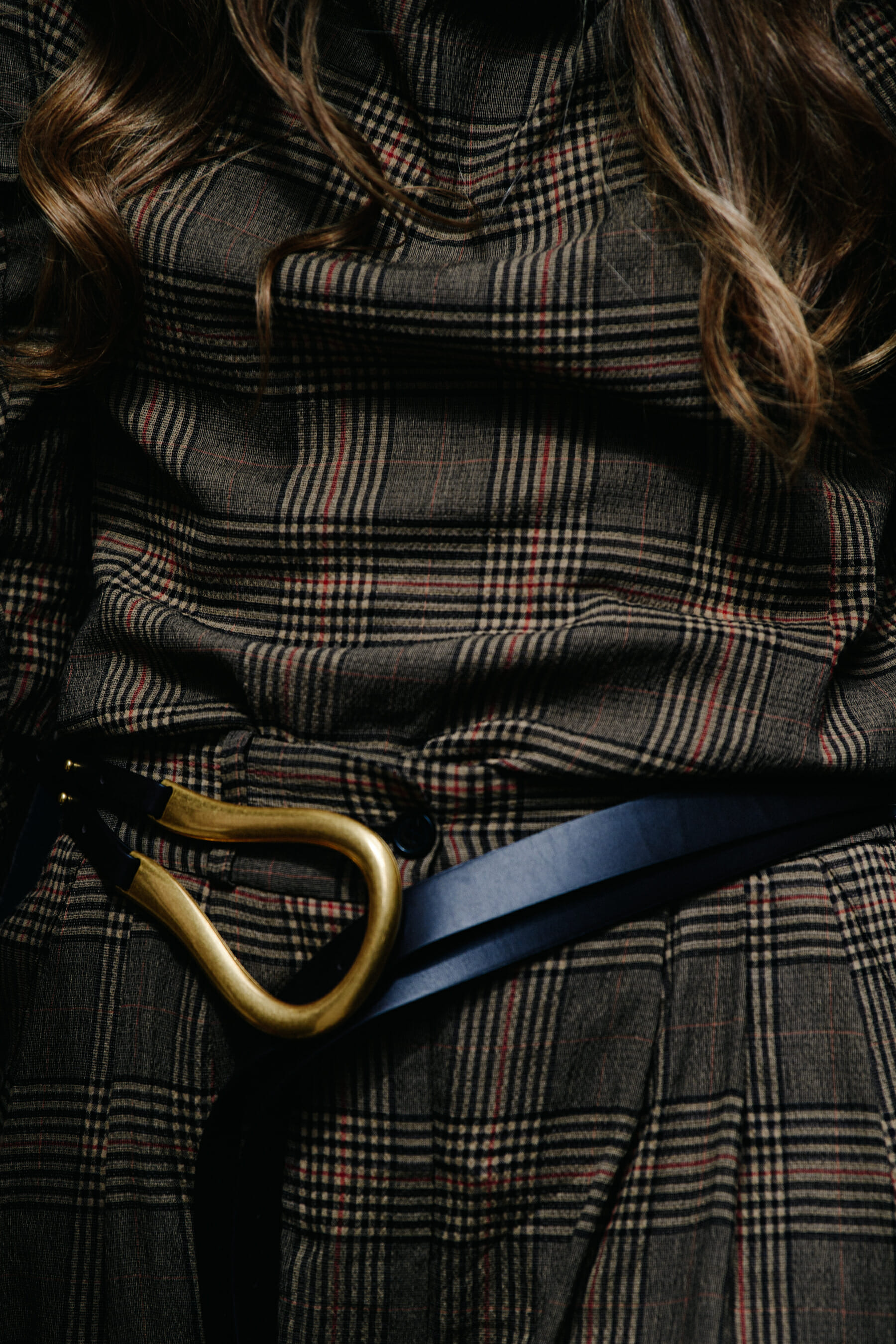 Woman wearing gold belt