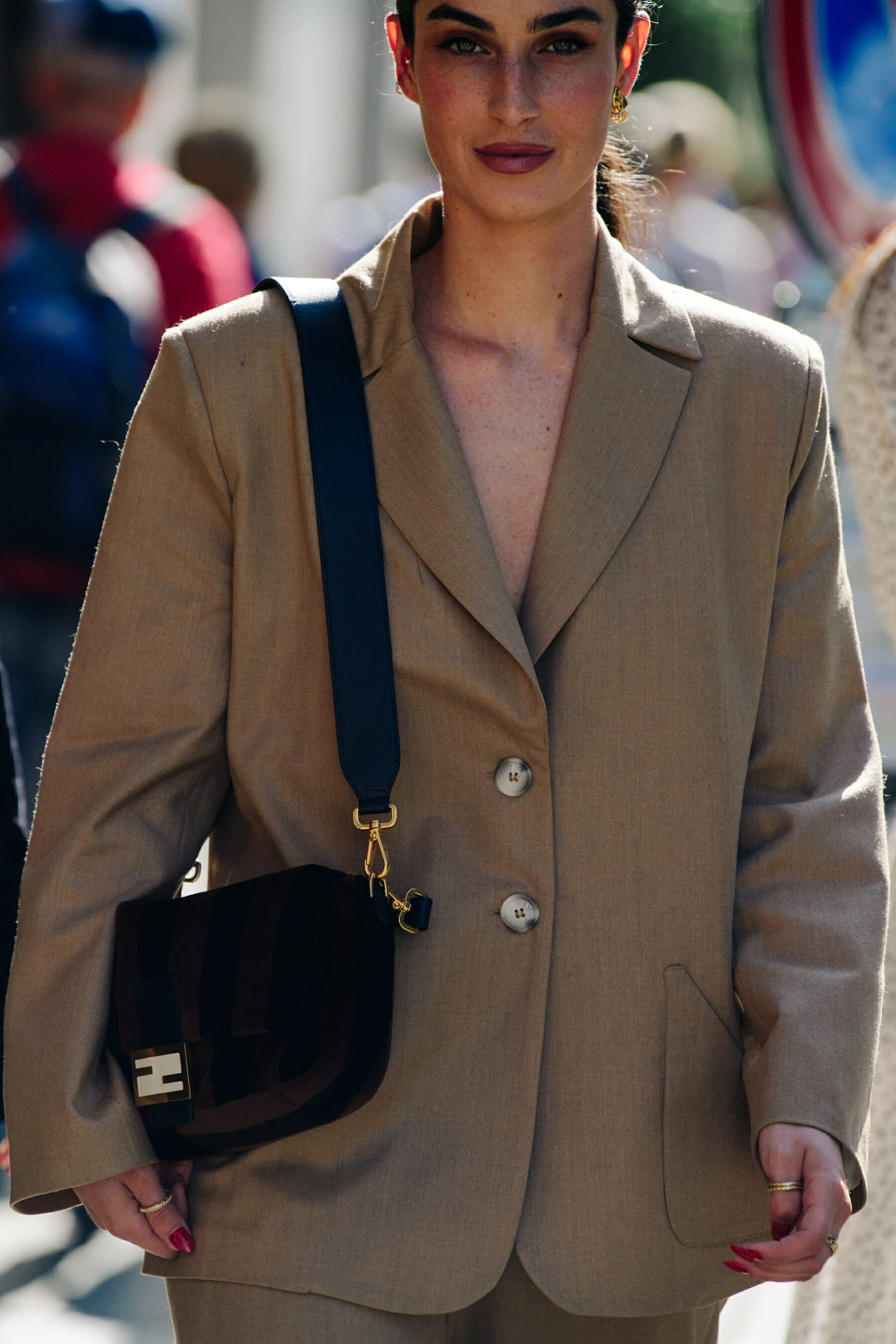 Woman wearing tan suit