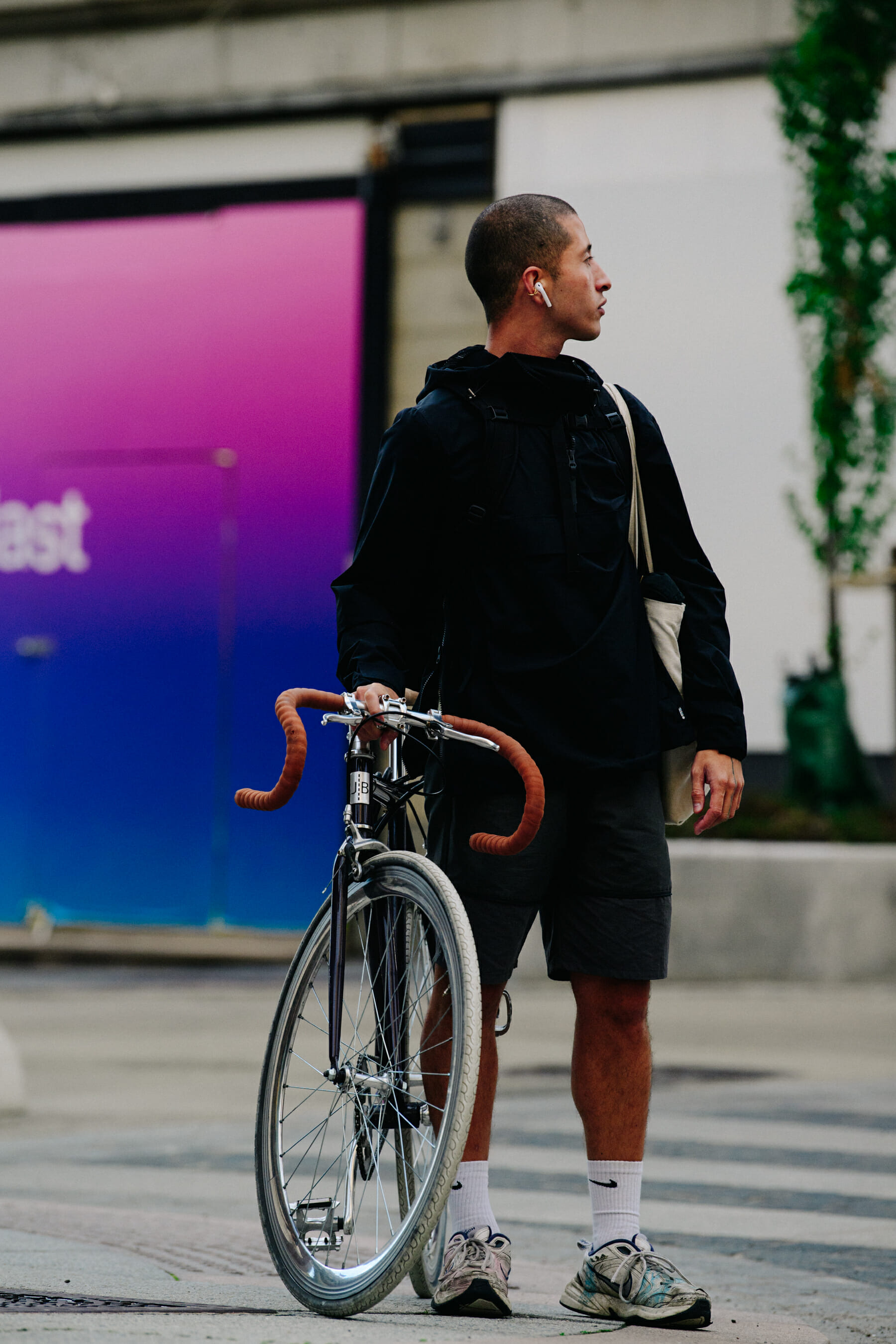Man standing with bicycle