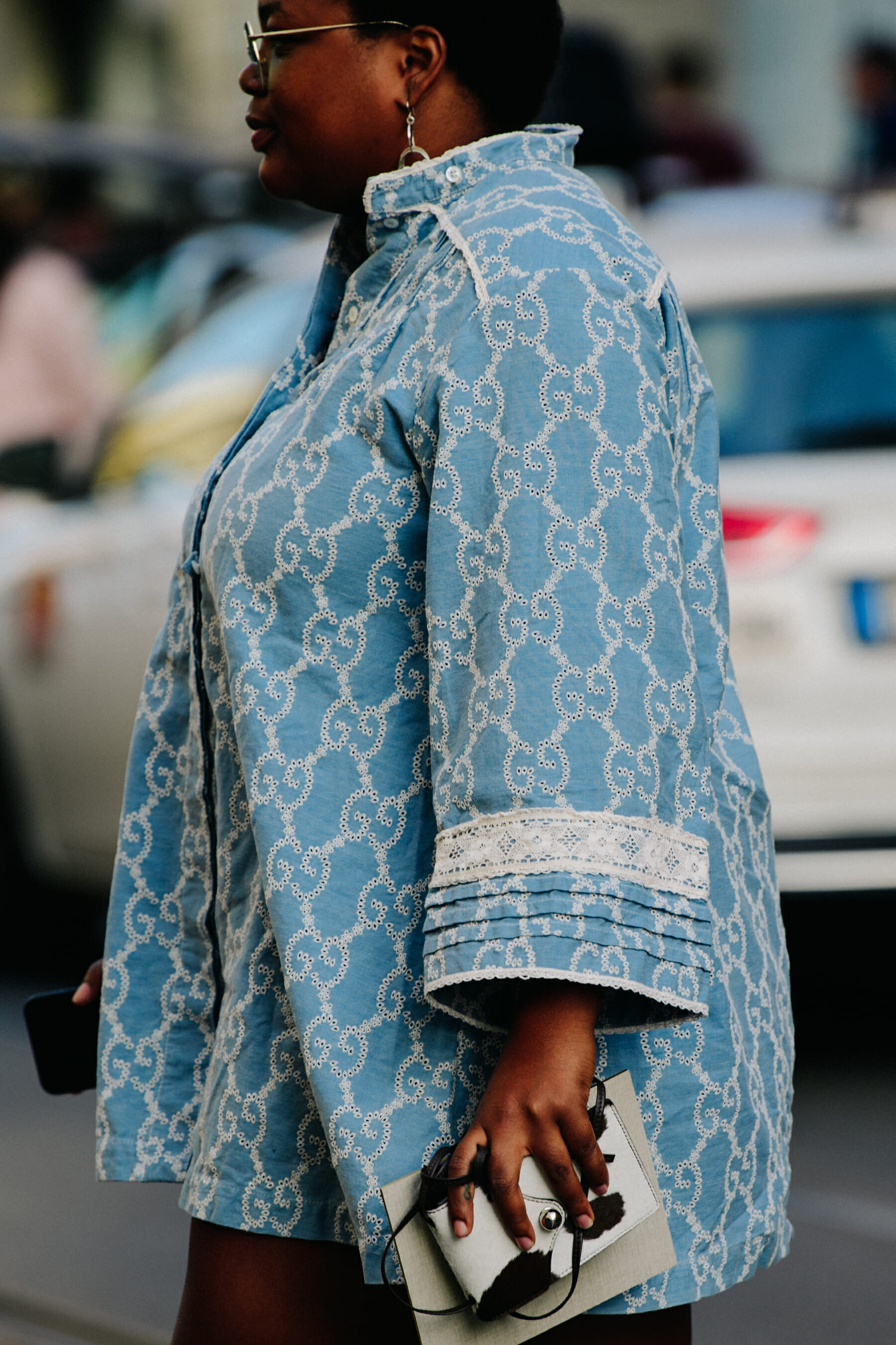 Woman wearing Gucci shirt