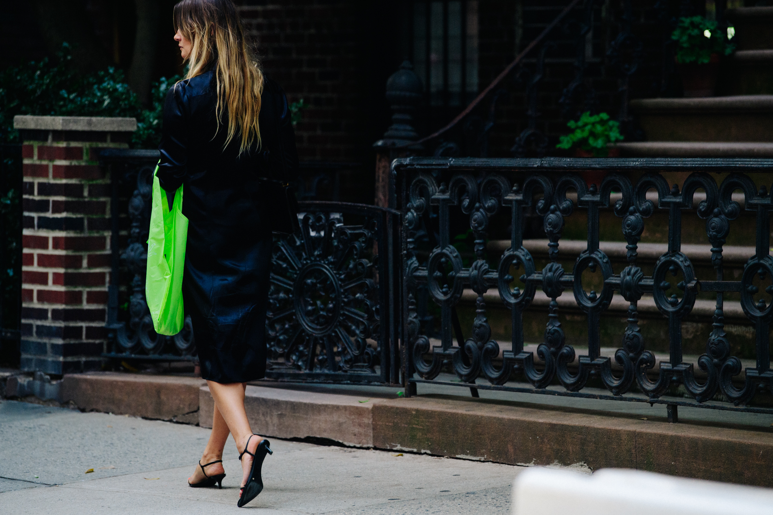 Woman carrying green bag