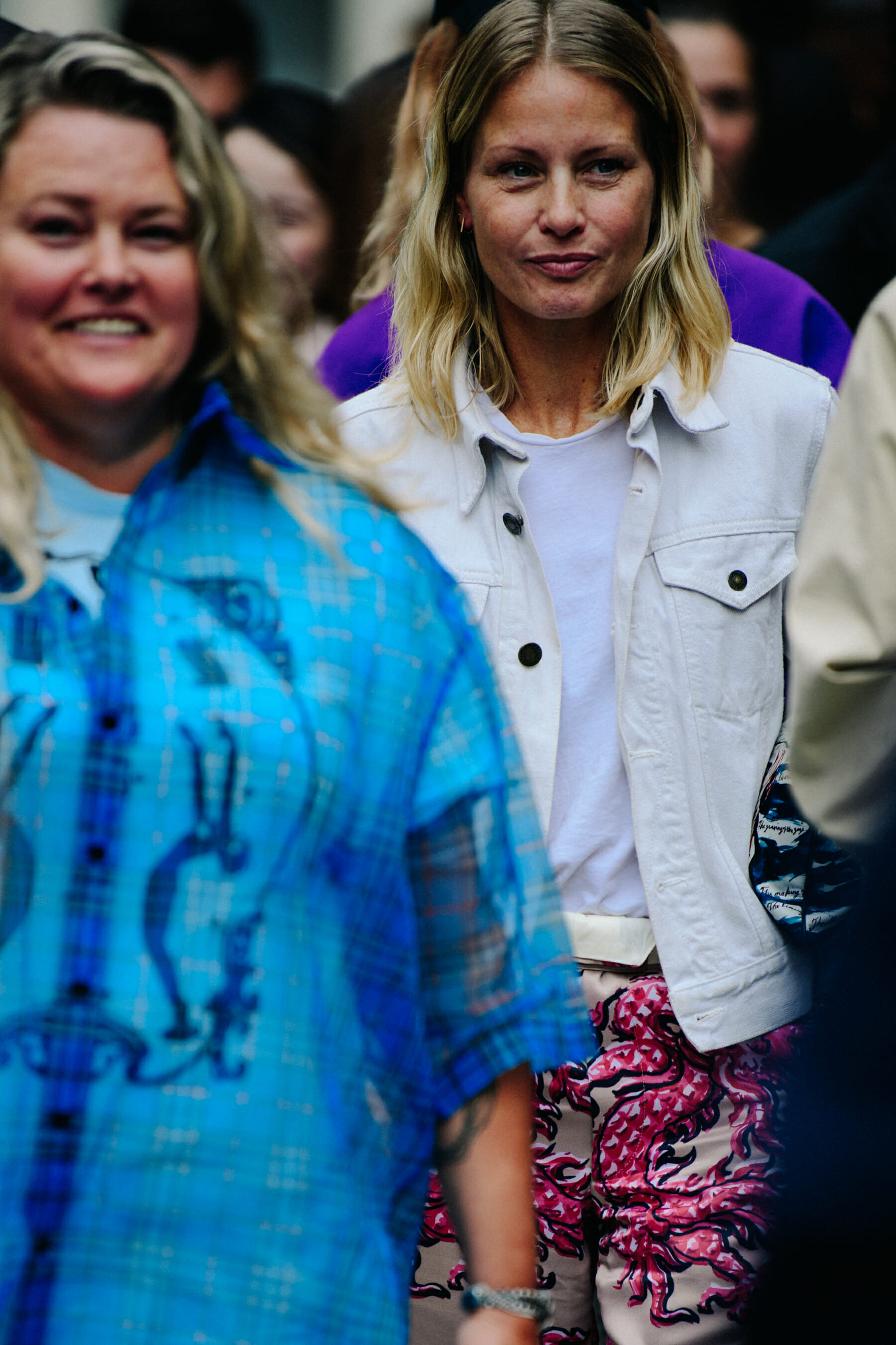Woman wearing white denim jacket
