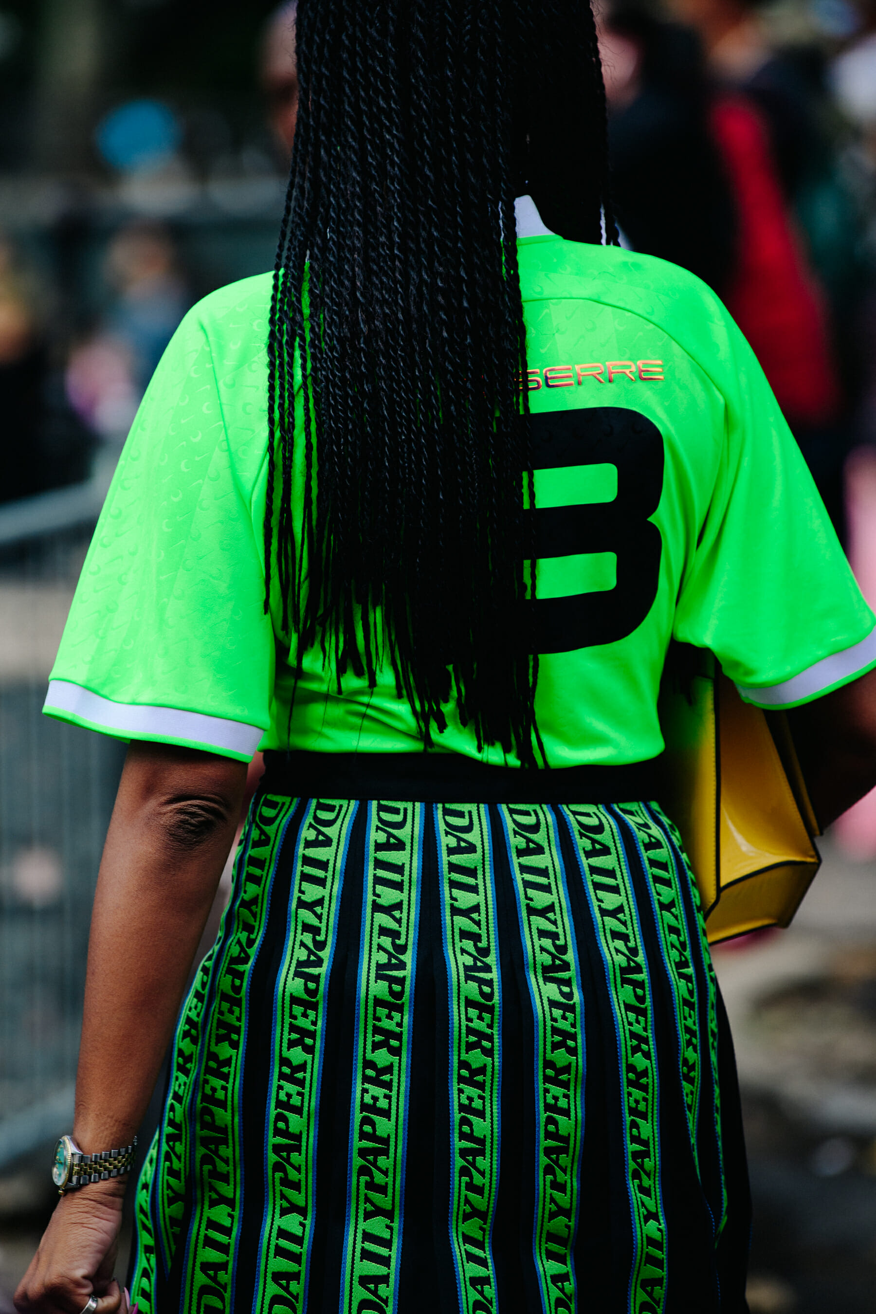 Woman wearing green sports shirt