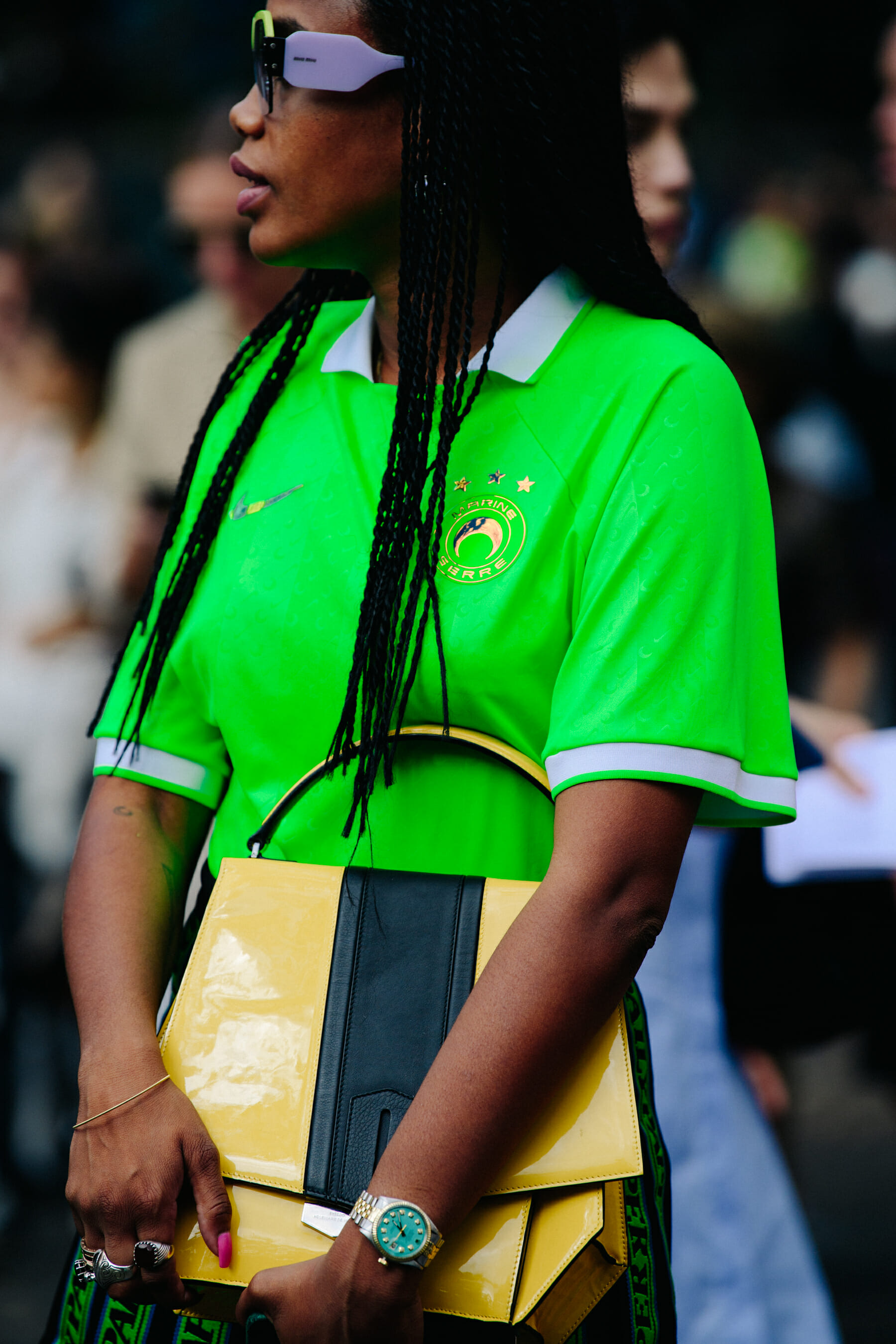 Woman wearing green sports shirt