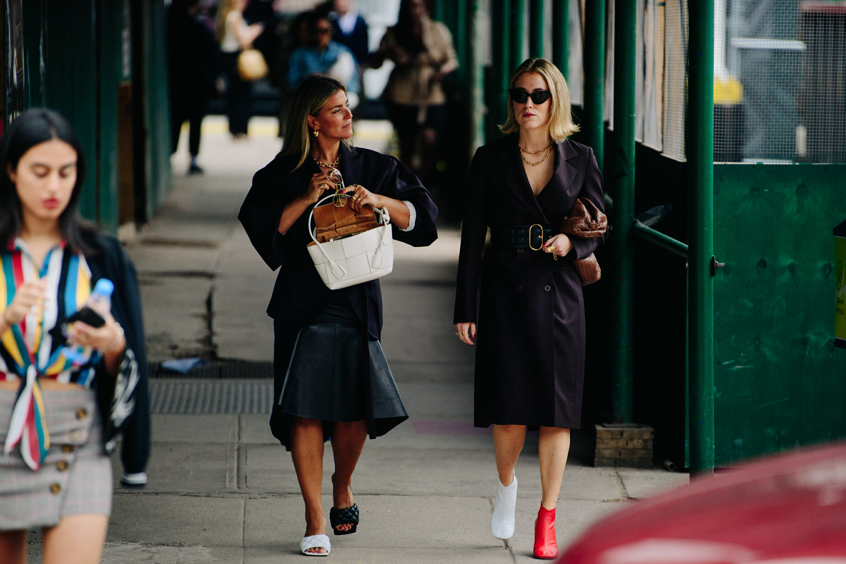Two women wearing black clothing