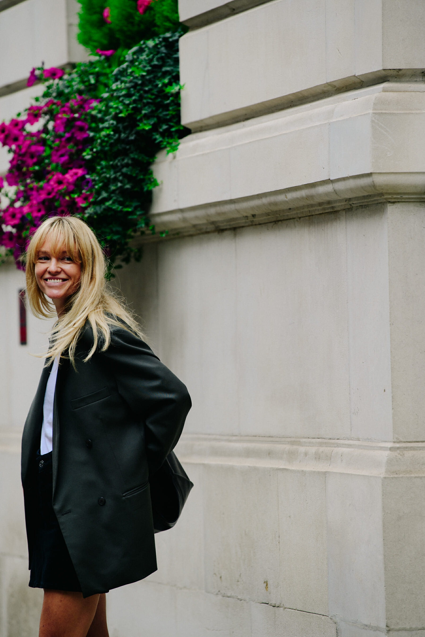 Woman wearing oversized suit jacket