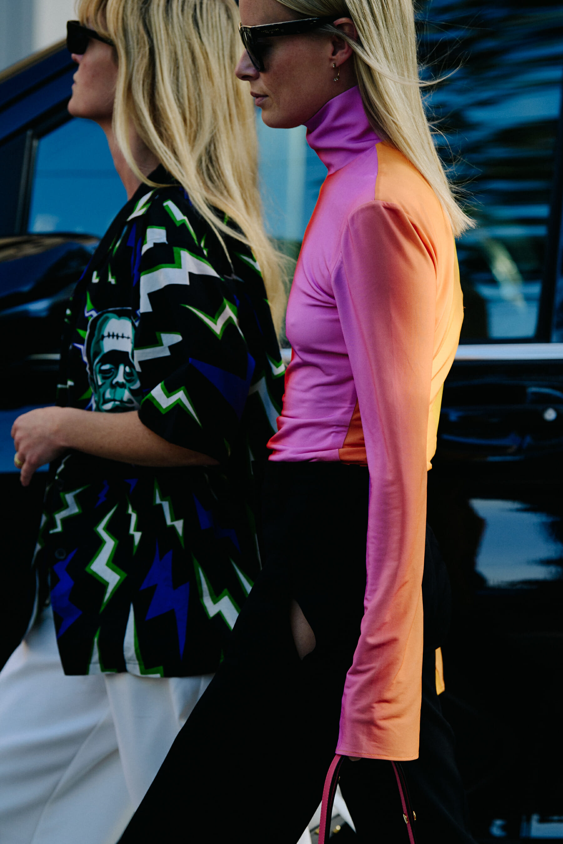 Two women wearing colourful tops