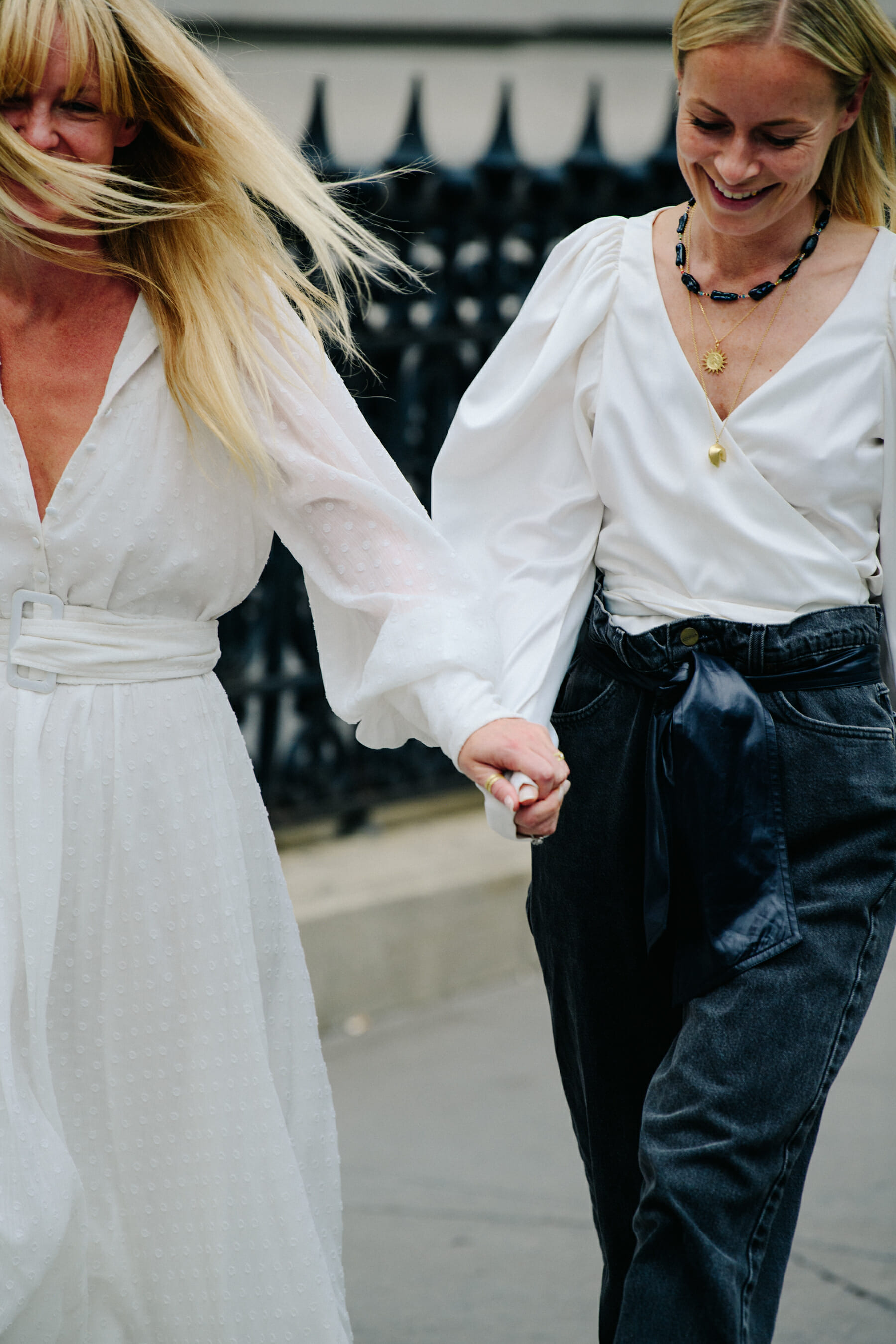 Two women wearing white