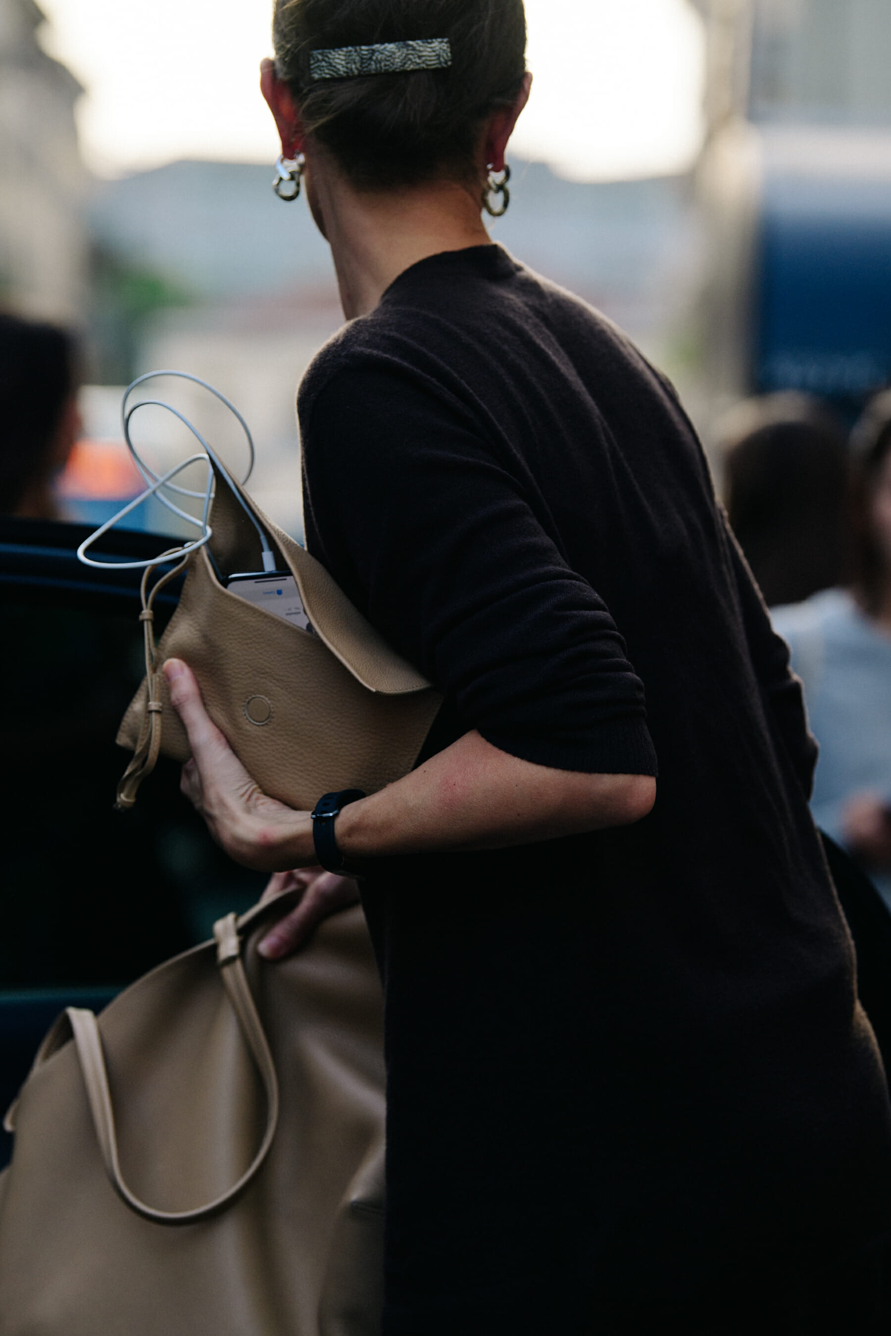 Woman wearing brown jumper