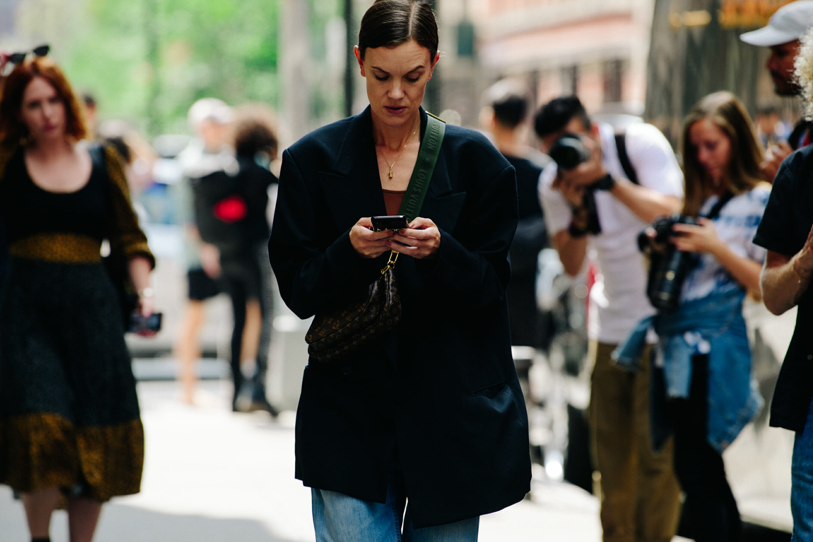 Woman wearing Louis Vuitton bag