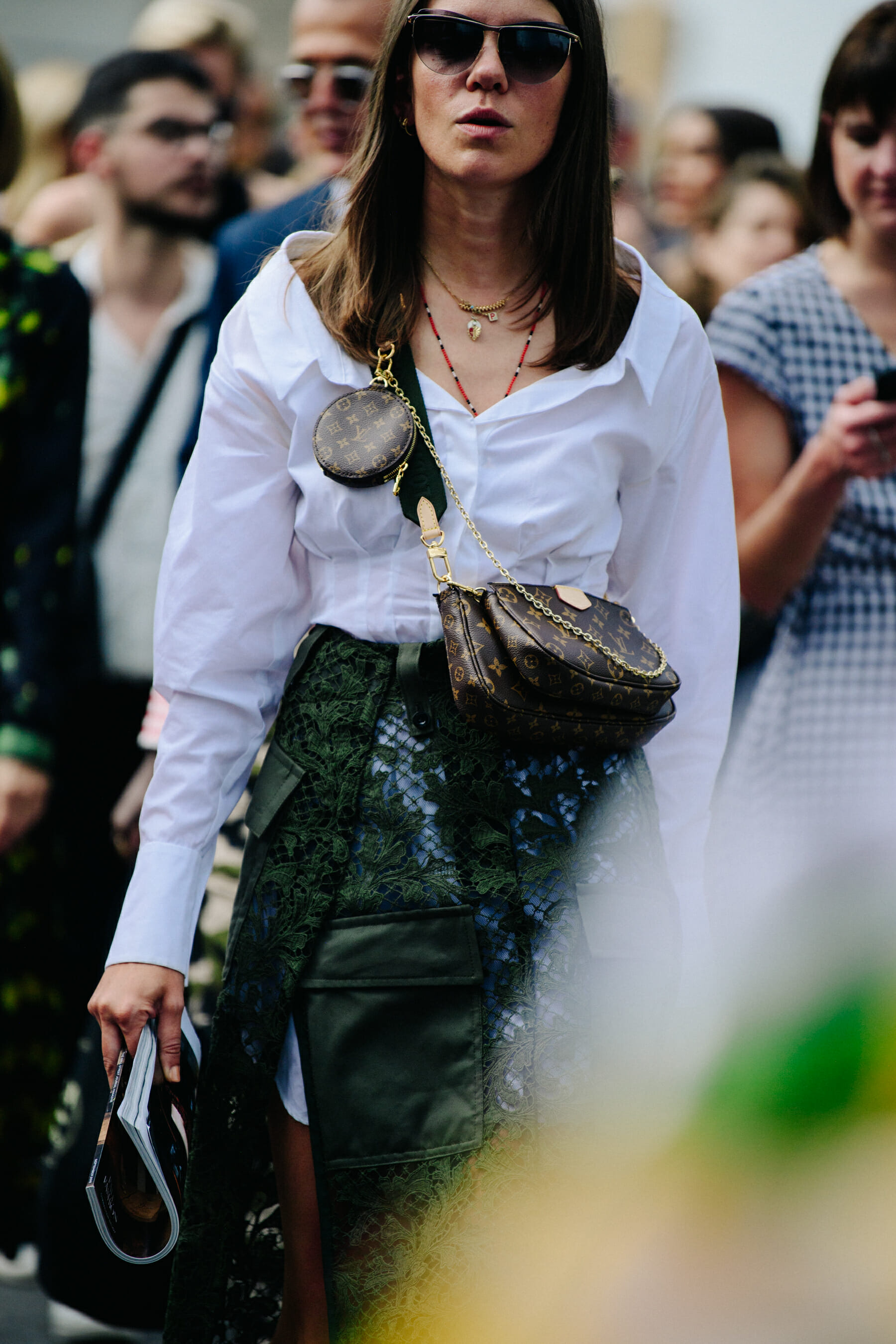 Woman wearing Louis Vuitton bag