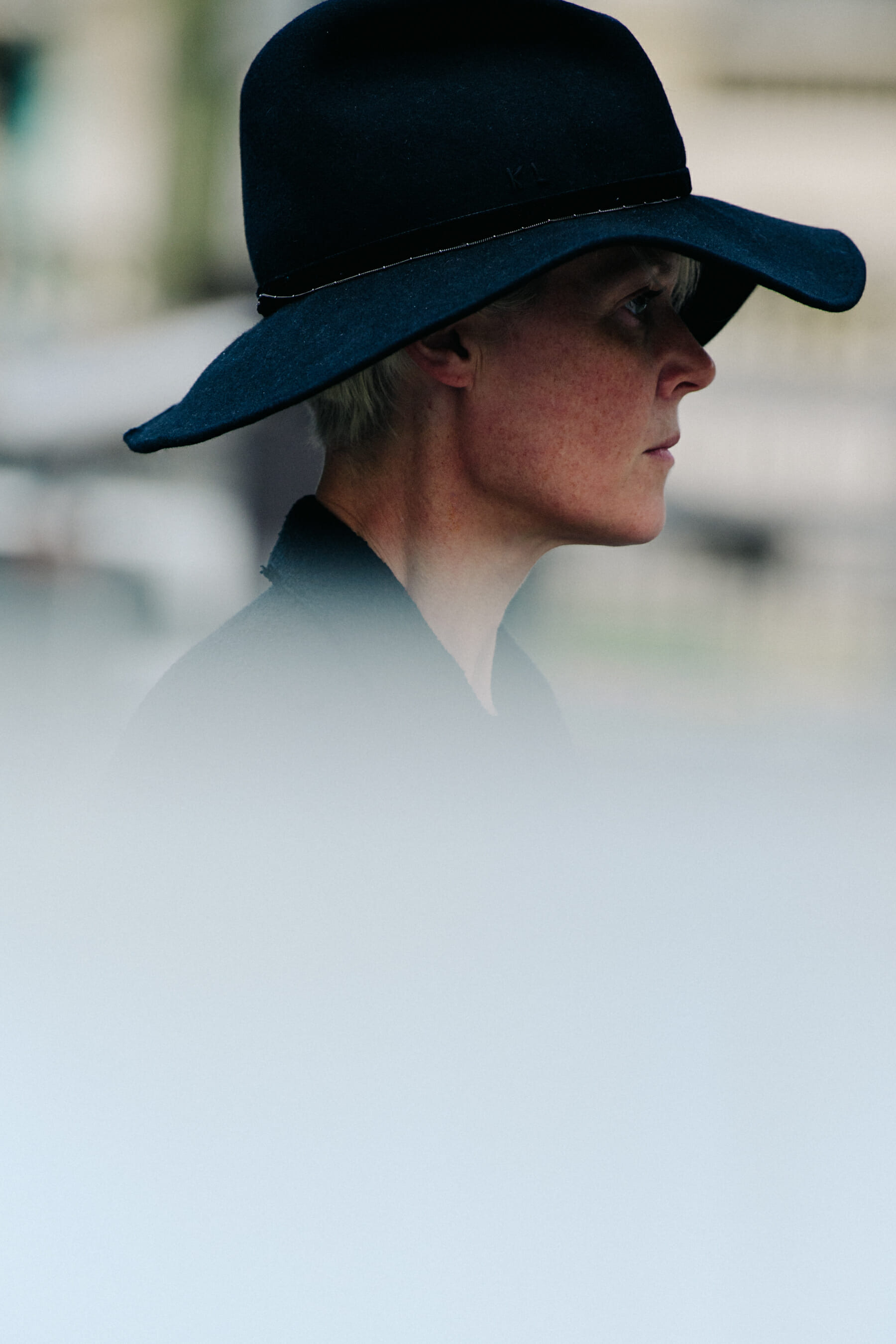 Woman wearing black hat
