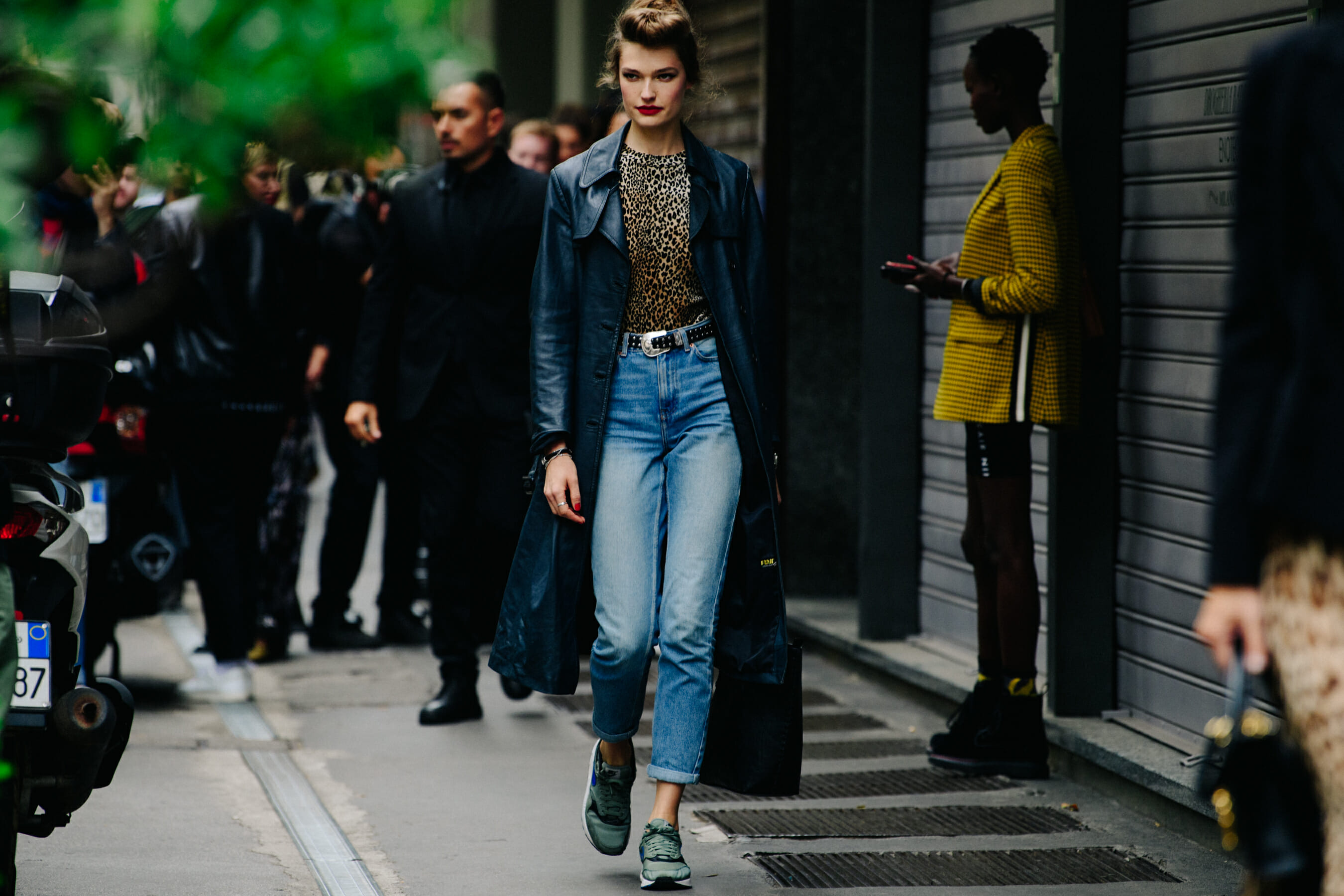 Model wearing long leather coat