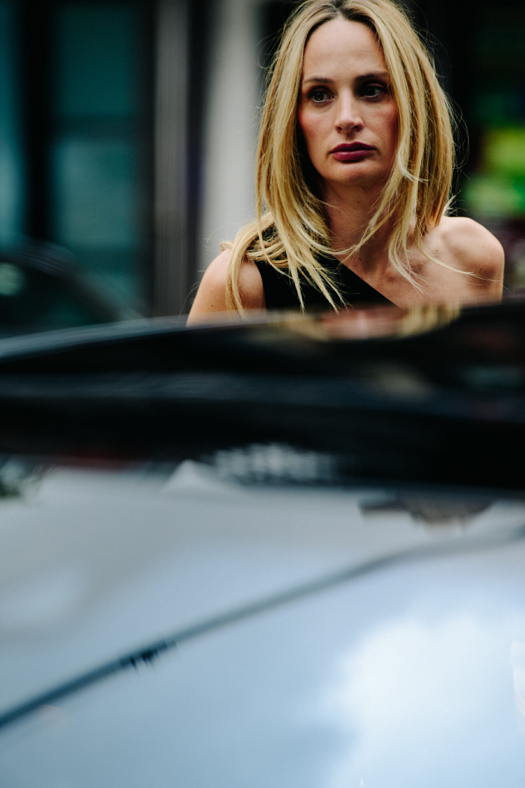 Woman wearing black shoulder dress