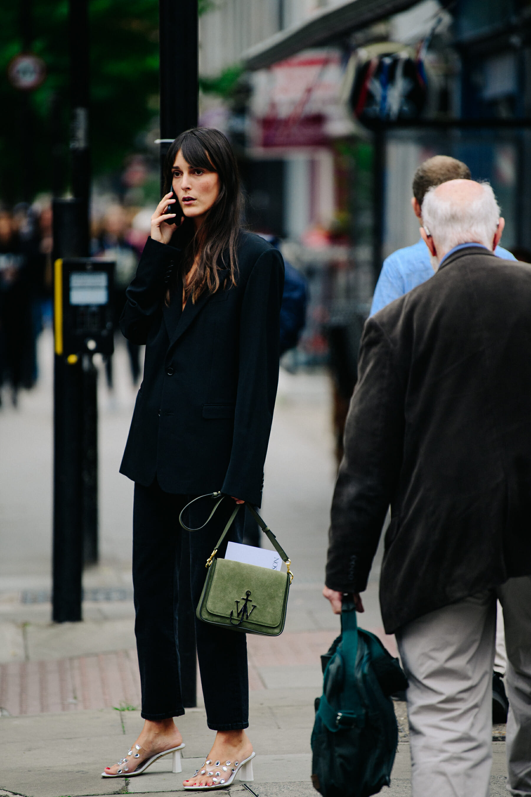 Woman carrying JW Anderson bag