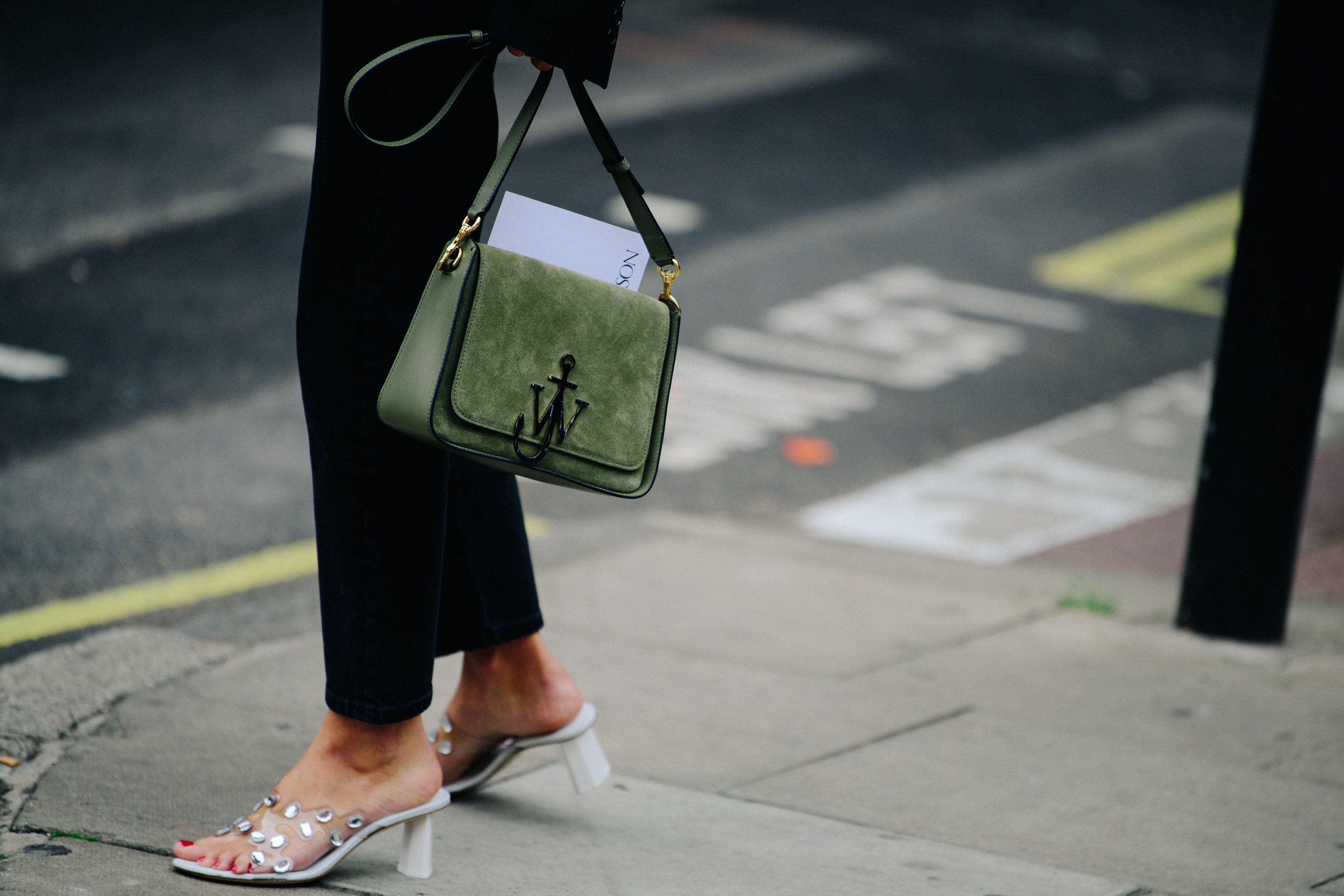 Woman carrying JW Anderson bag