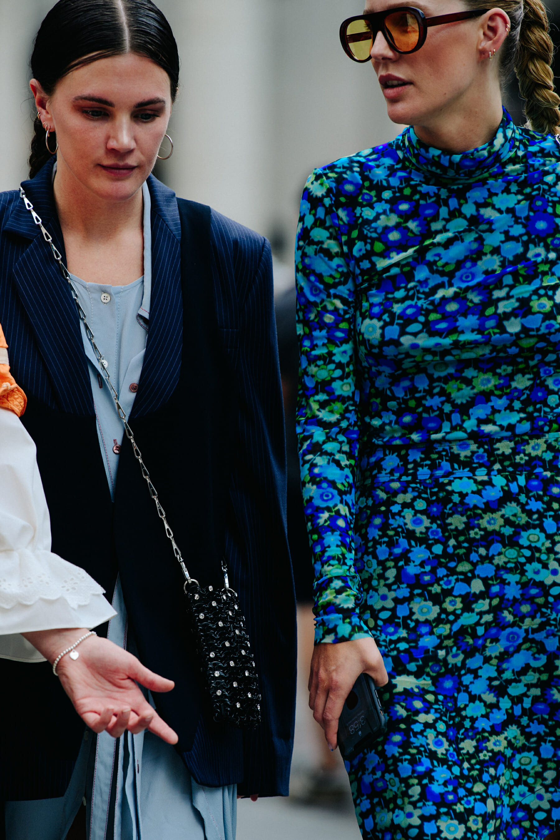 Two women wearing smart clothing
