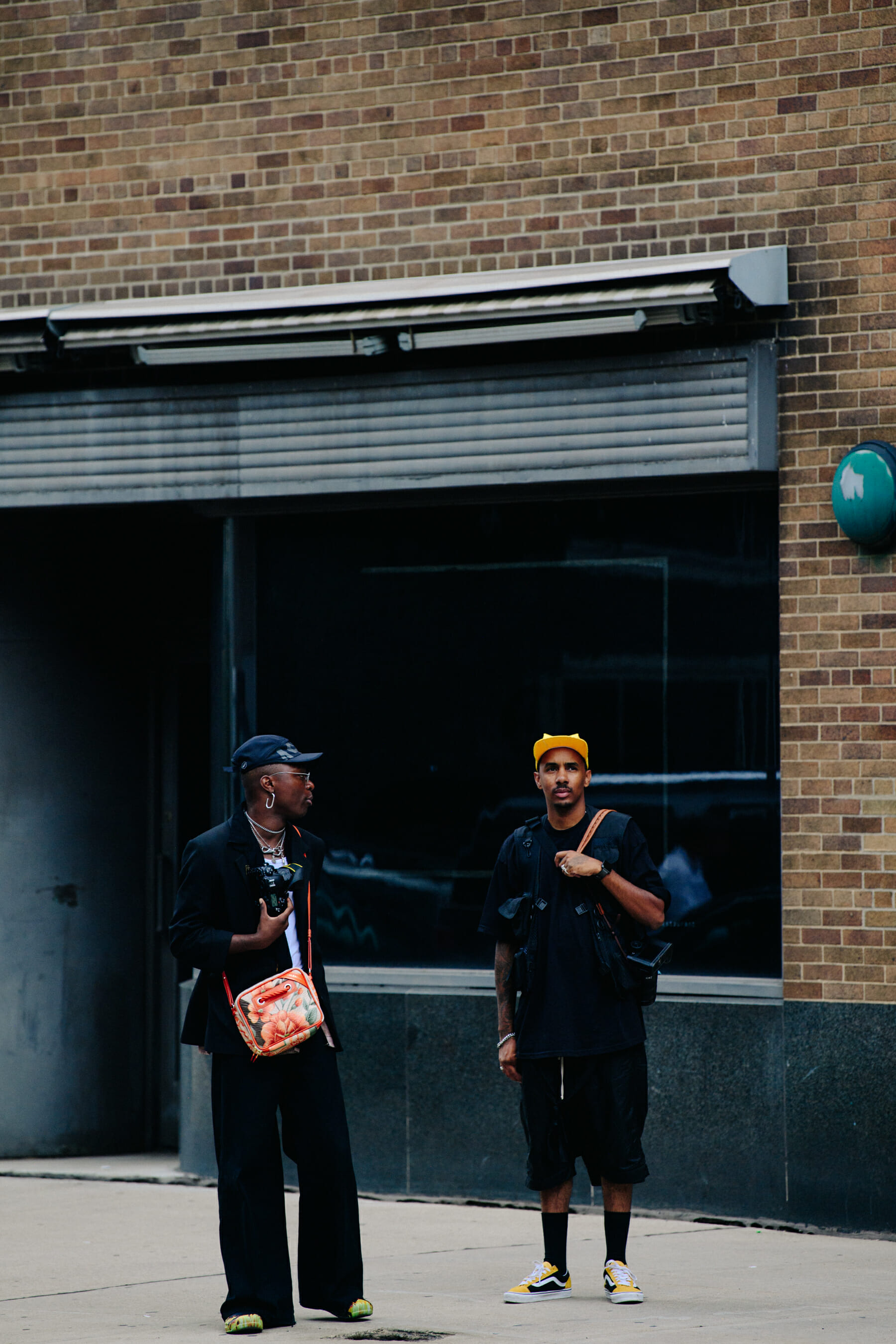 Two men wearing black