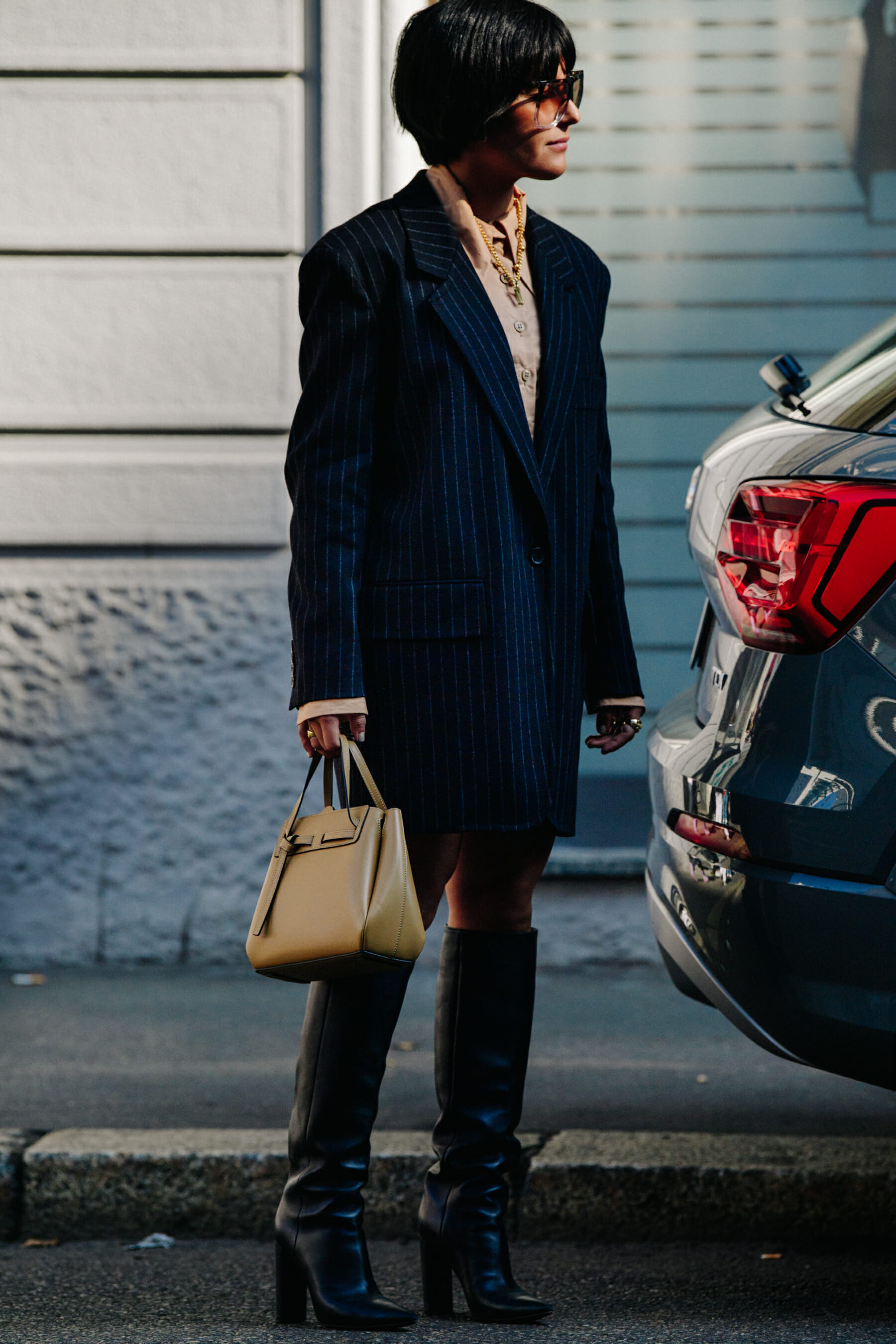 Woman wearing striped coat
