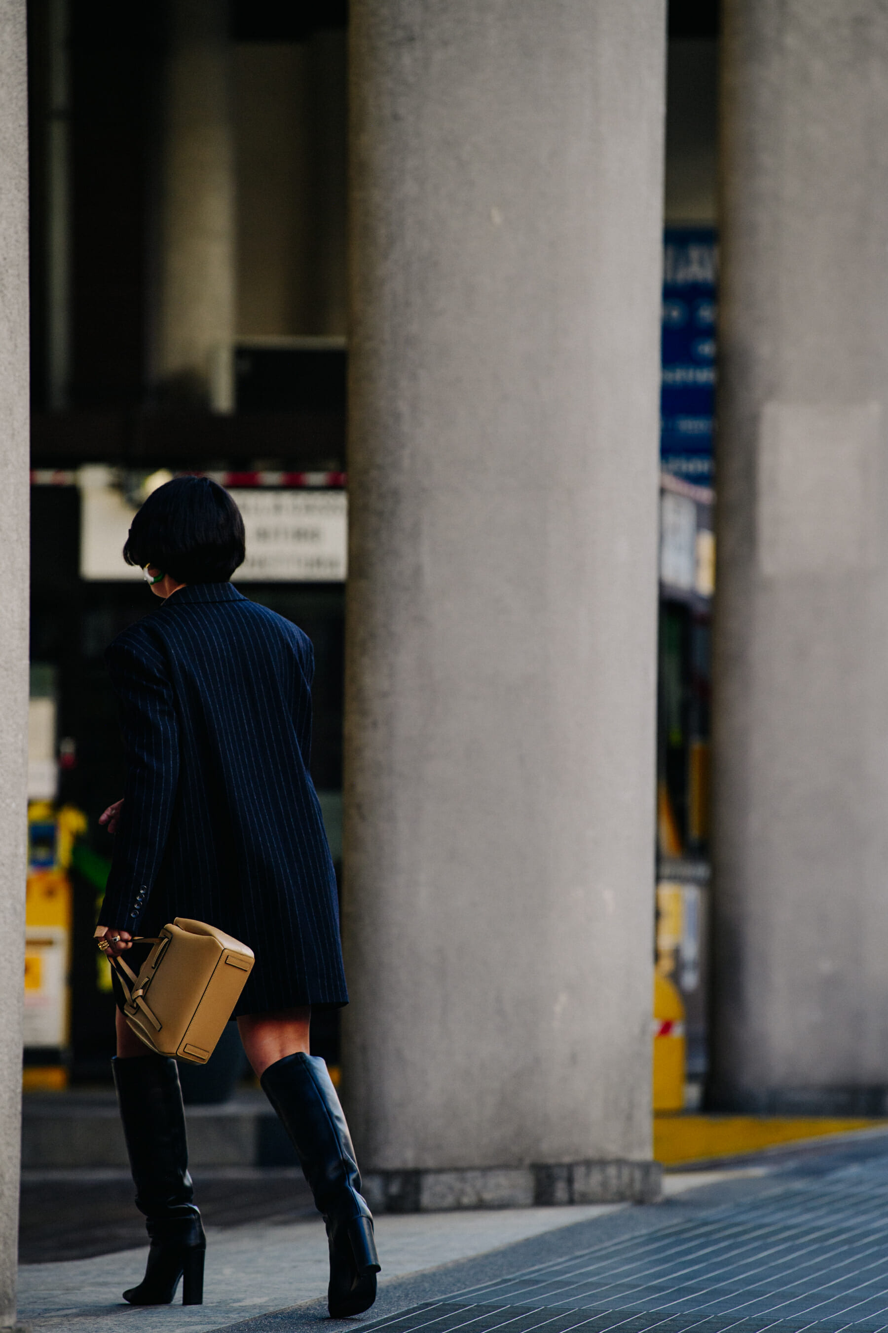 Woman wearing striped coat