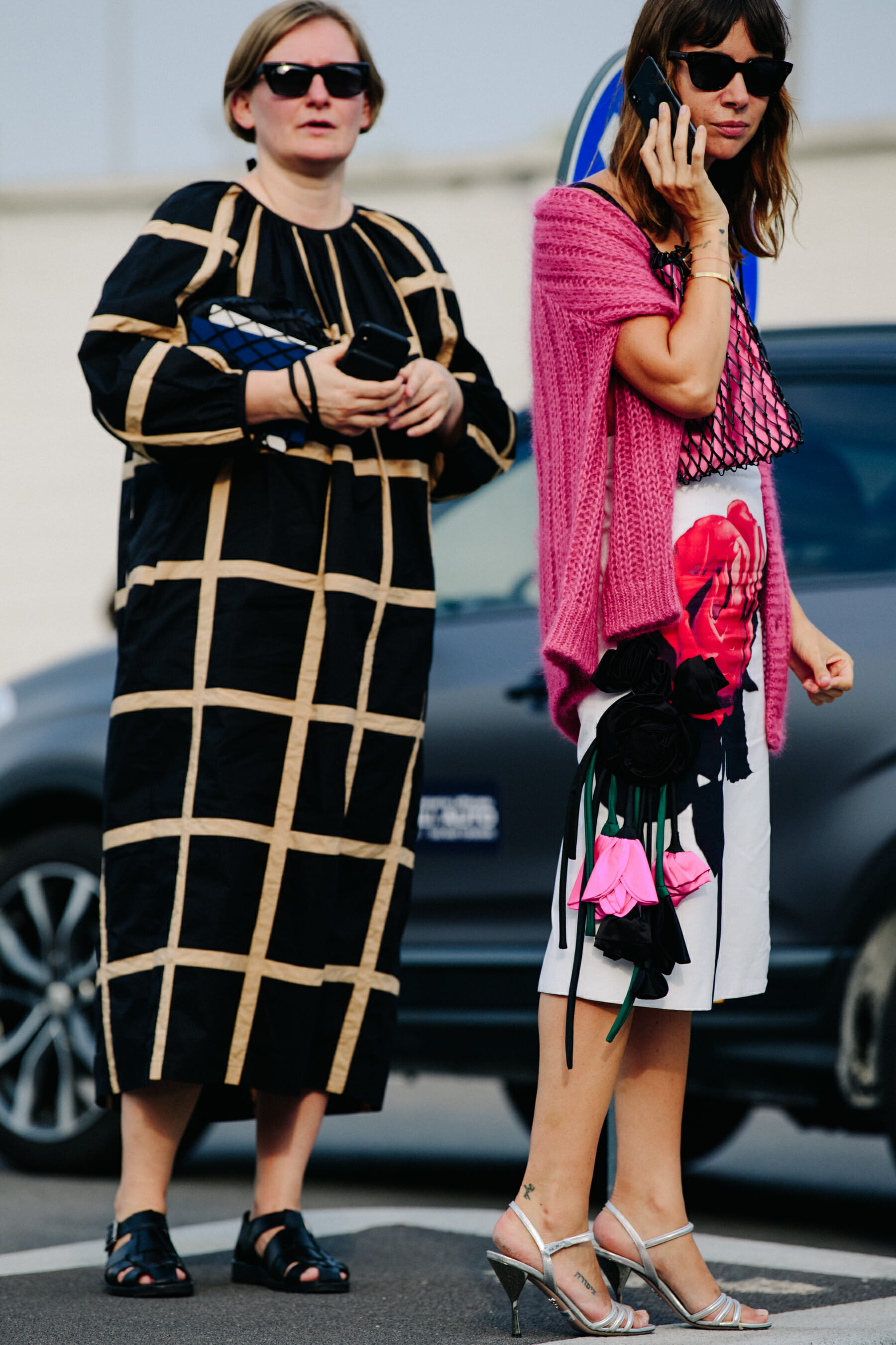 Two women wearing dresses